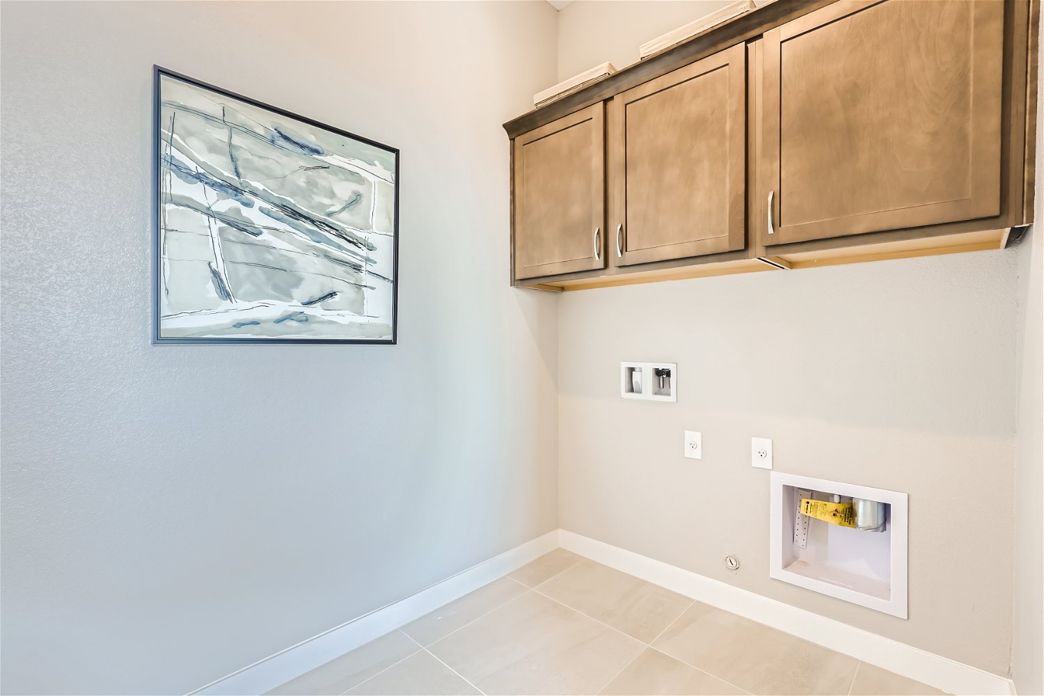 A room with a picture on the wall.