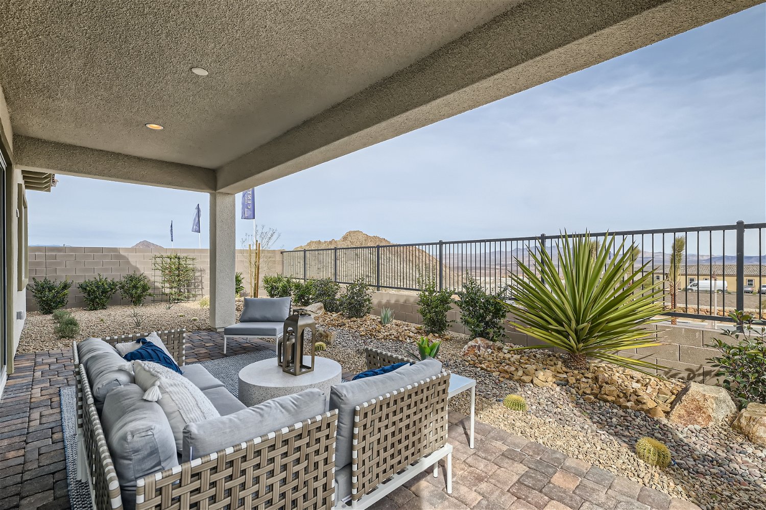 A patio with a patio and a patio with a view of the ocean.