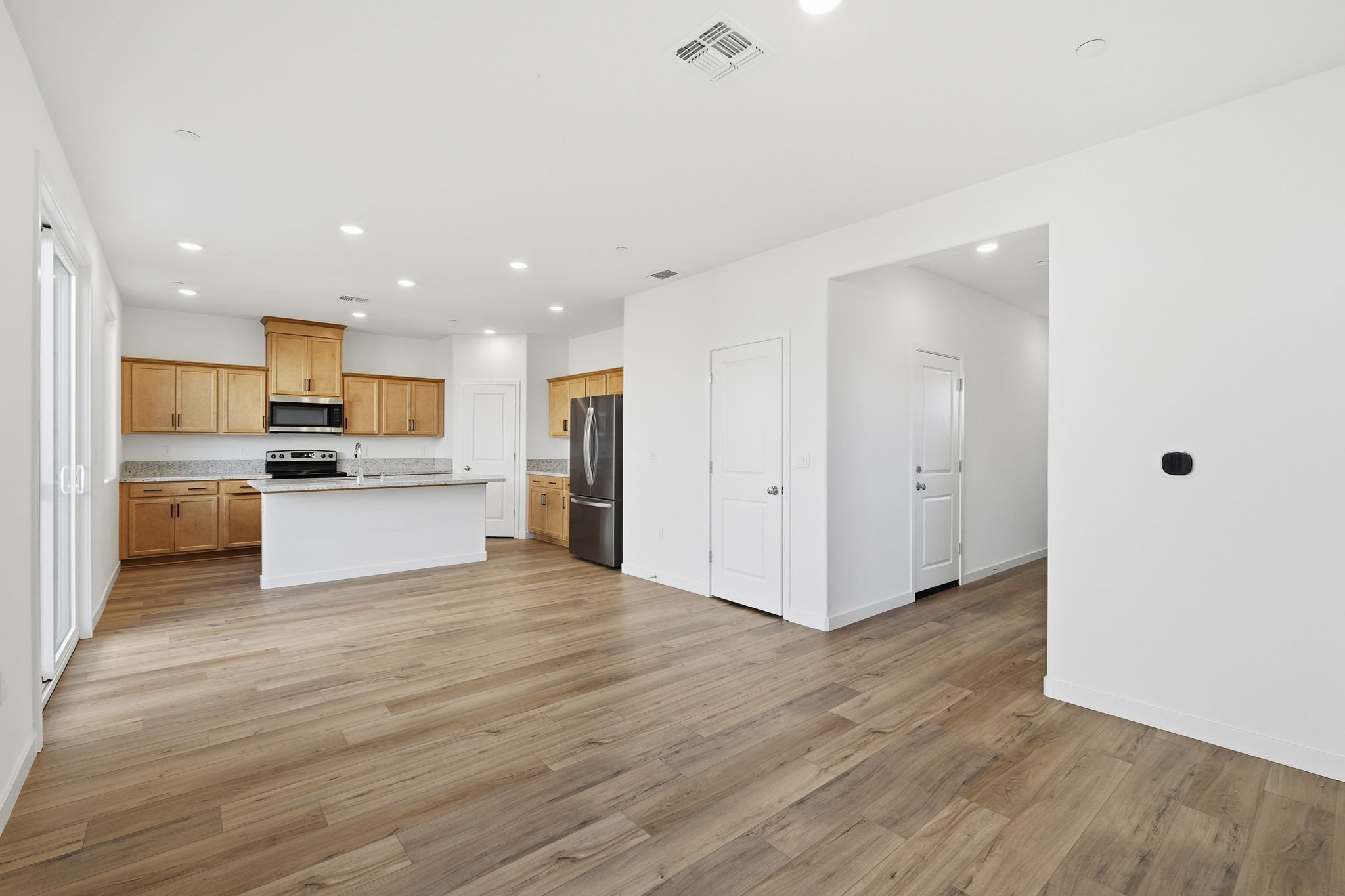 A kitchen with wooden floors.