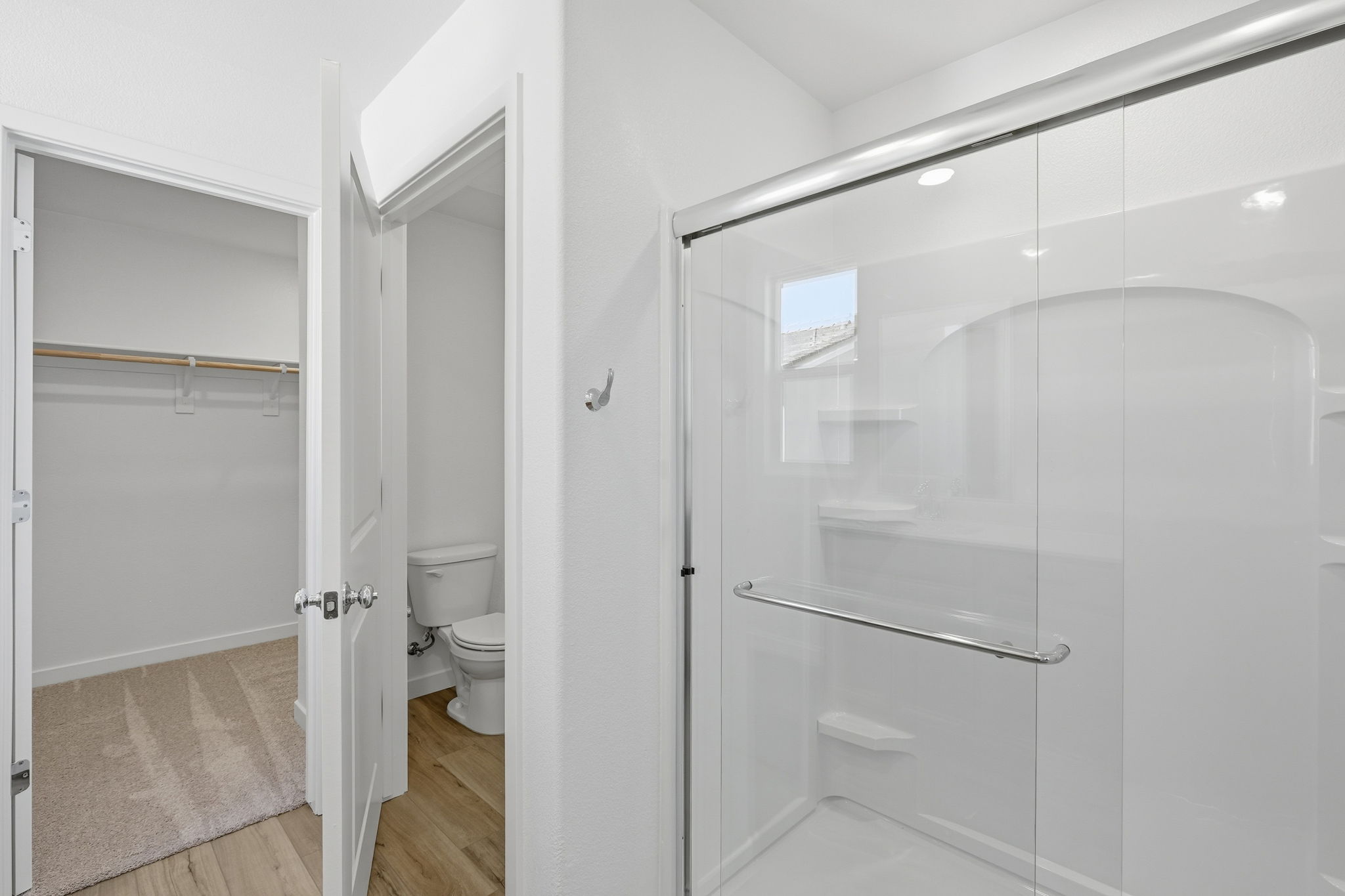 A bathroom with a glass shower.