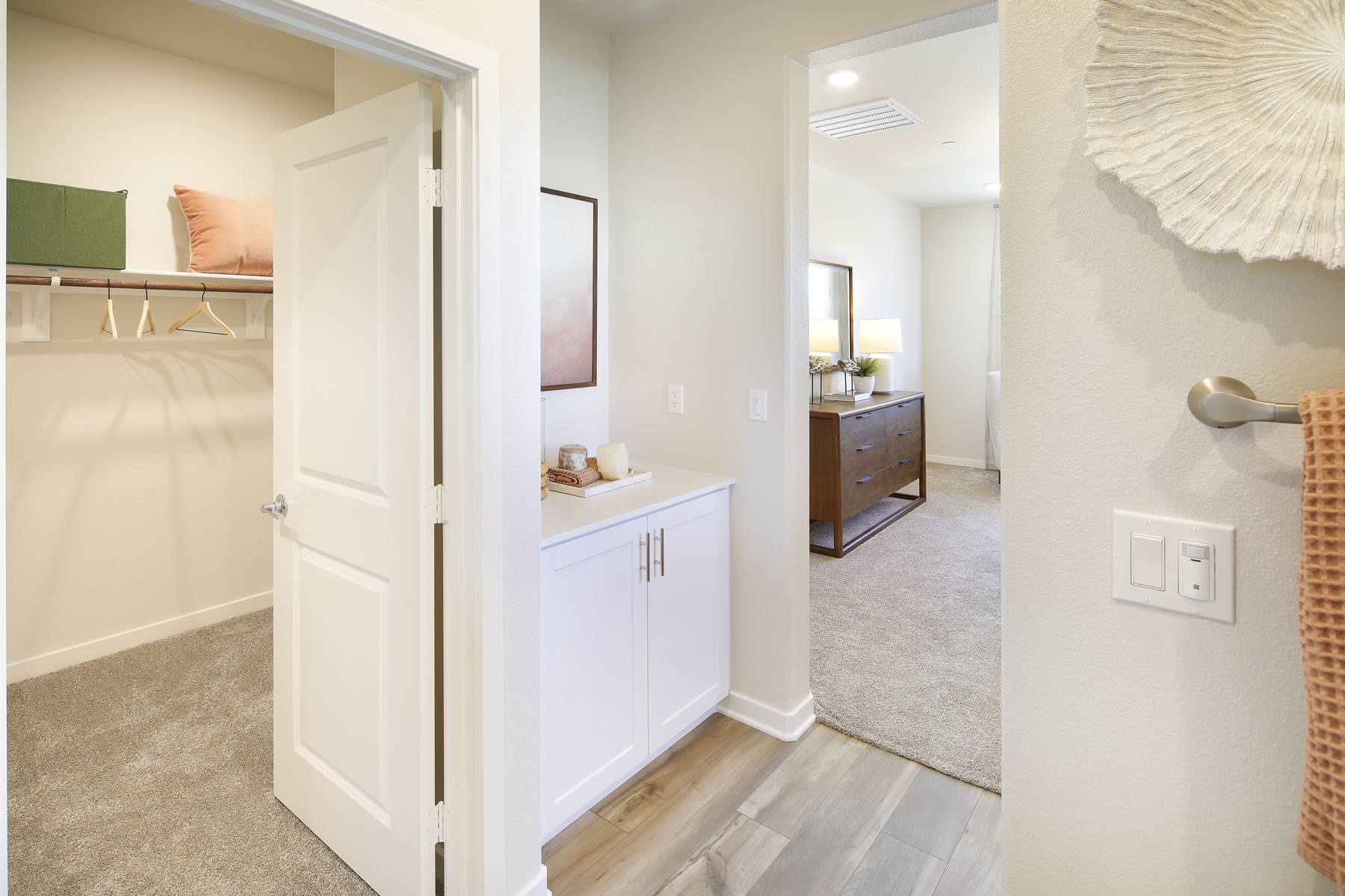 A bathroom with a white door.