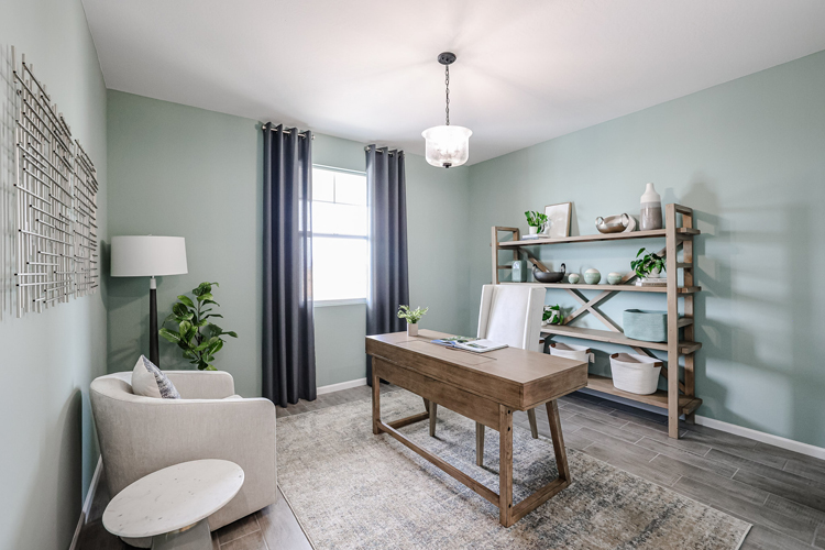 A room with a table and chairs.