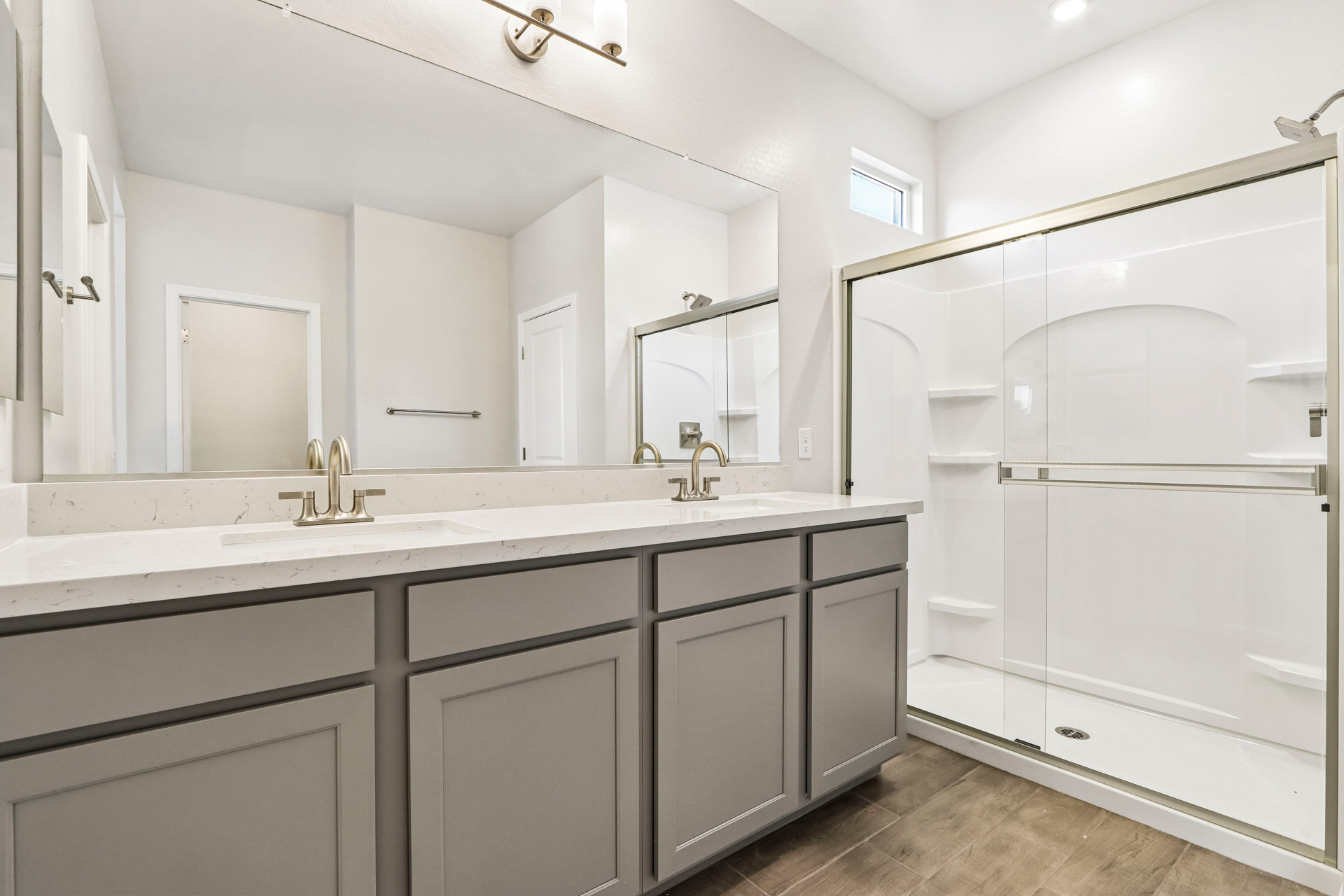 A bathroom with a large mirror.