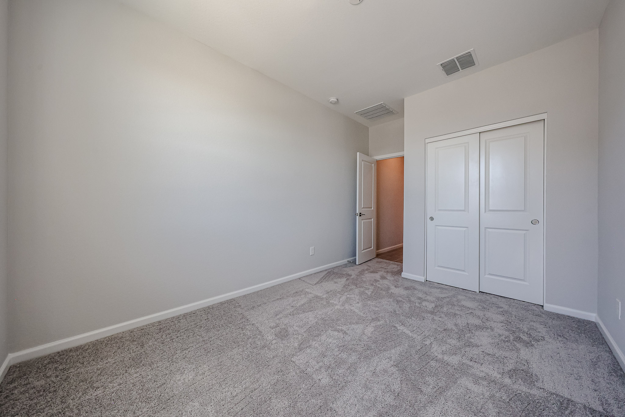 A room with white doors.