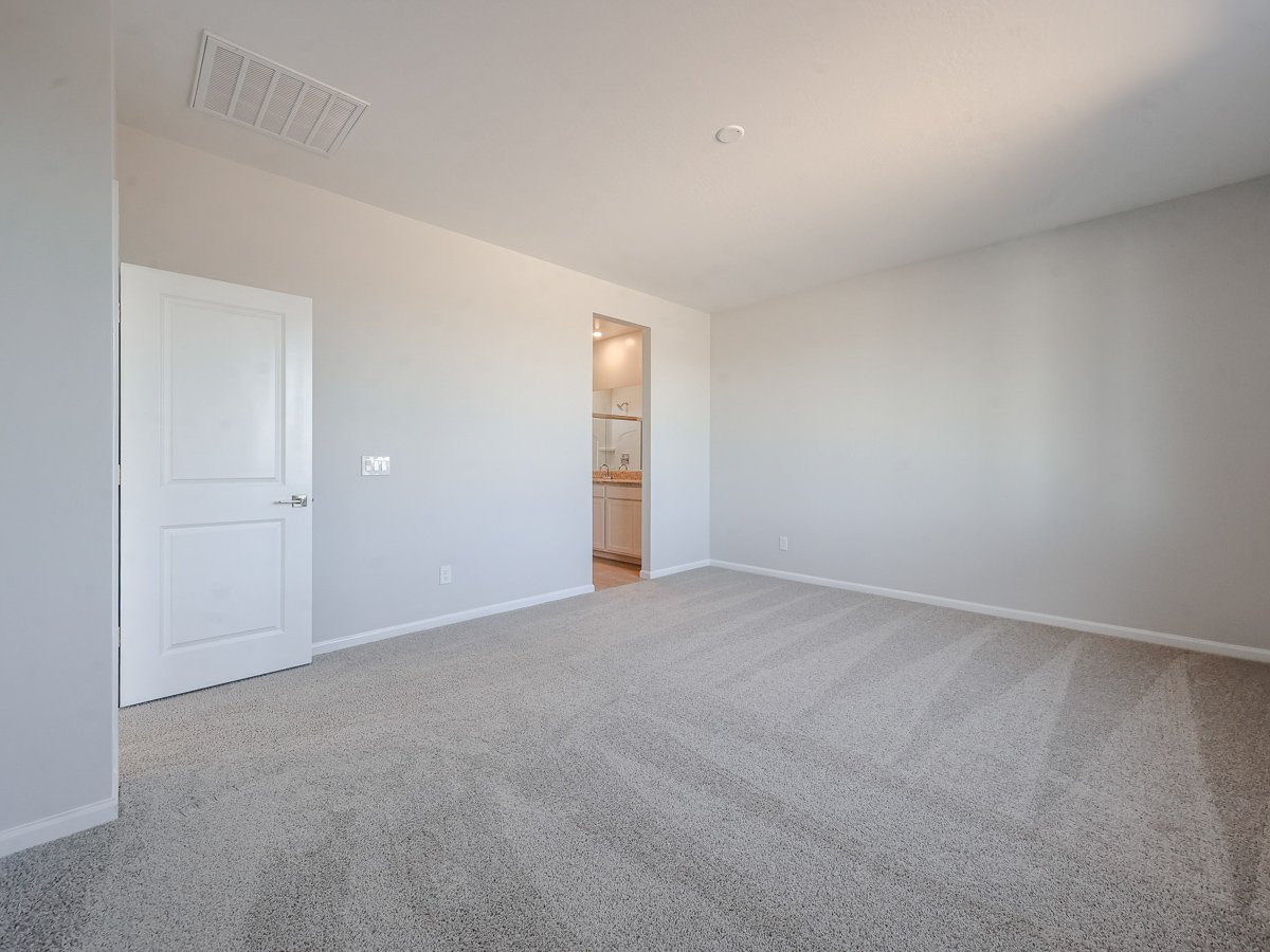 A hallway with white doors.