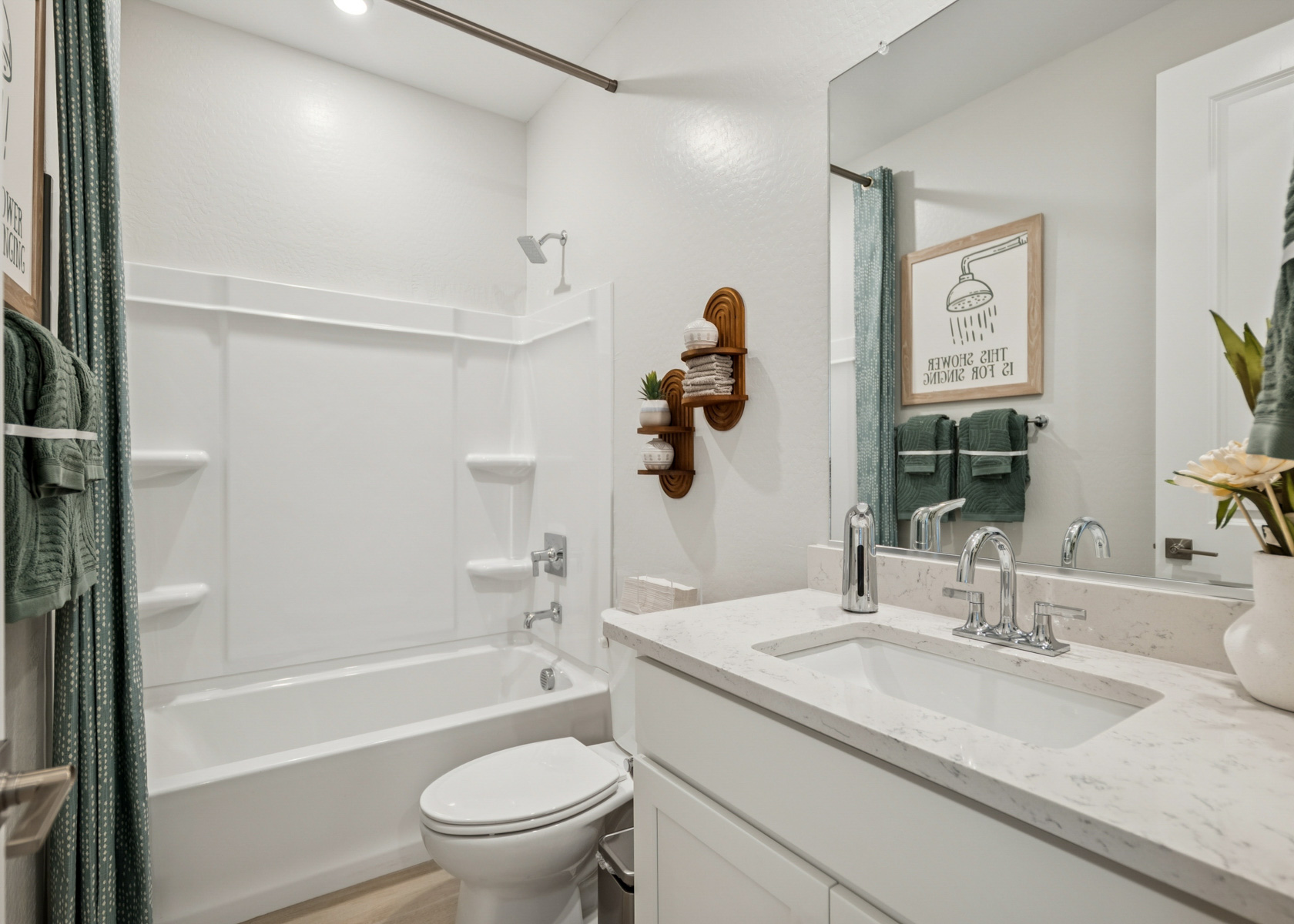 A bathroom with a sink toilet and bathtub.