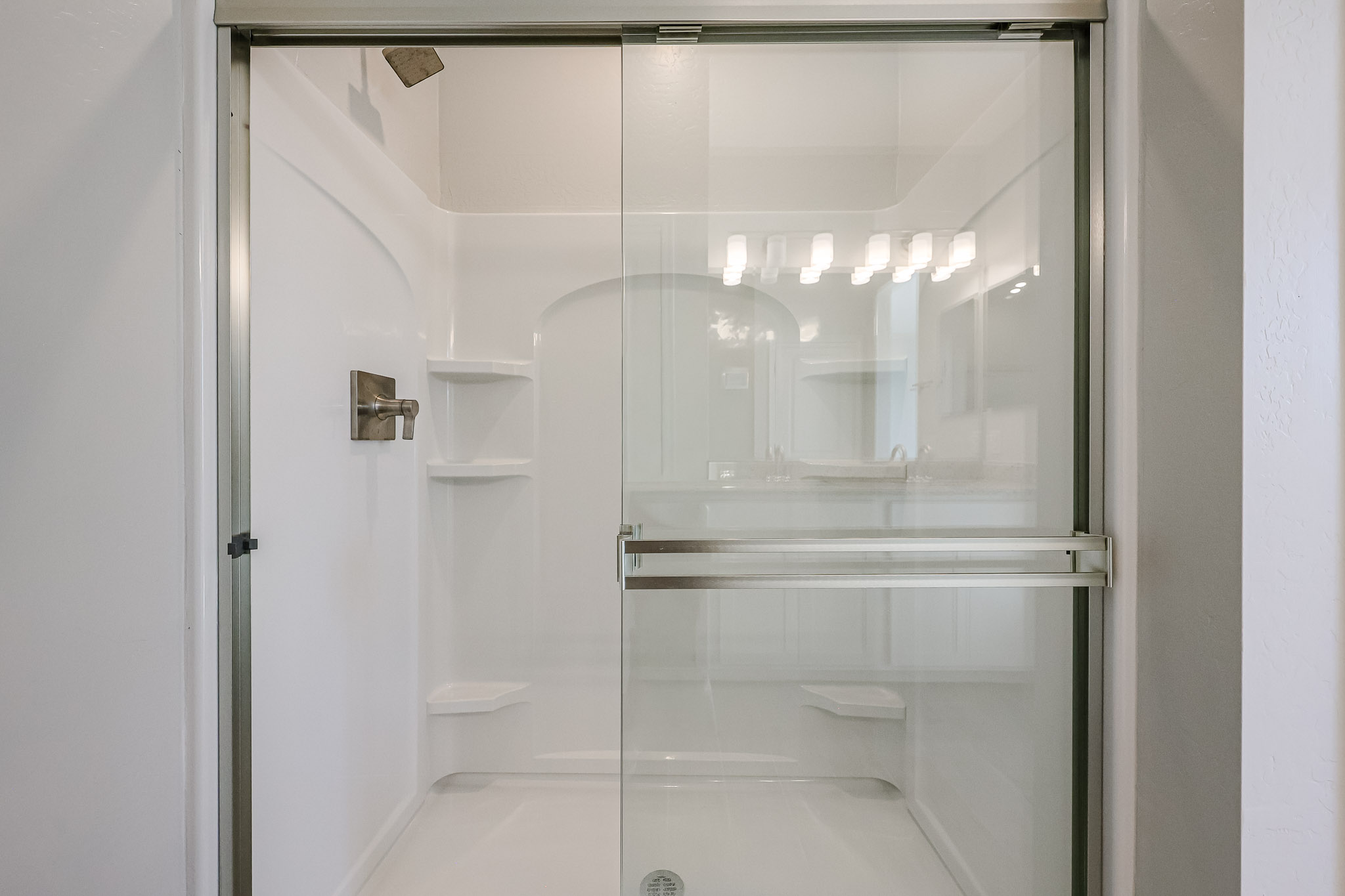 A bathroom with a glass shower.