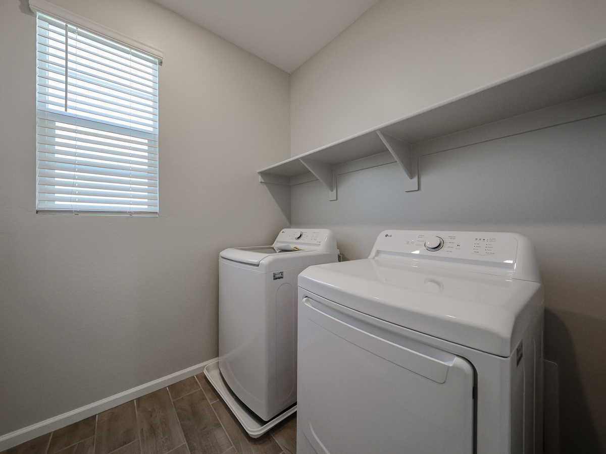 A washing machine in a room.
