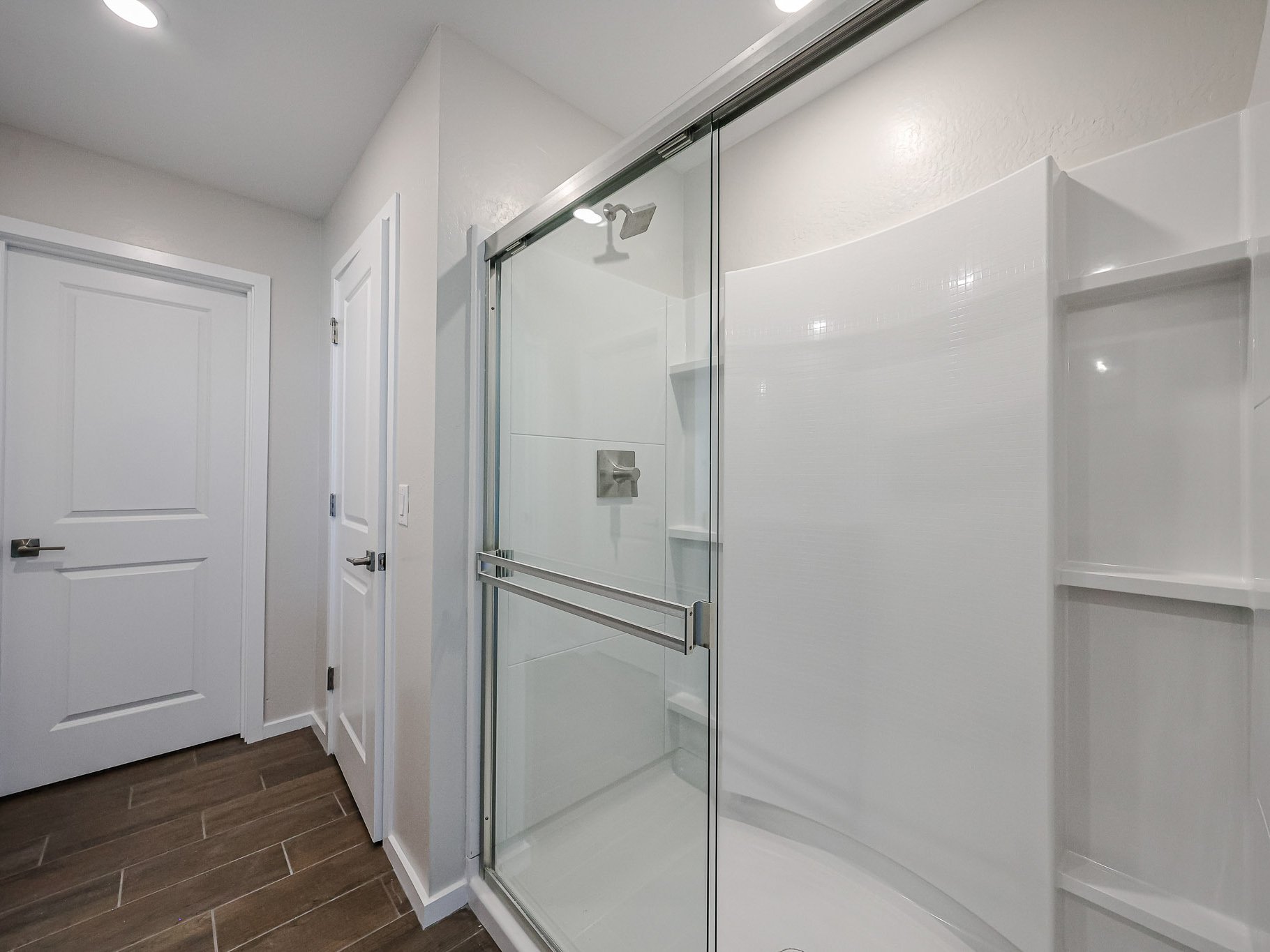 A shower unit in a bathroom.