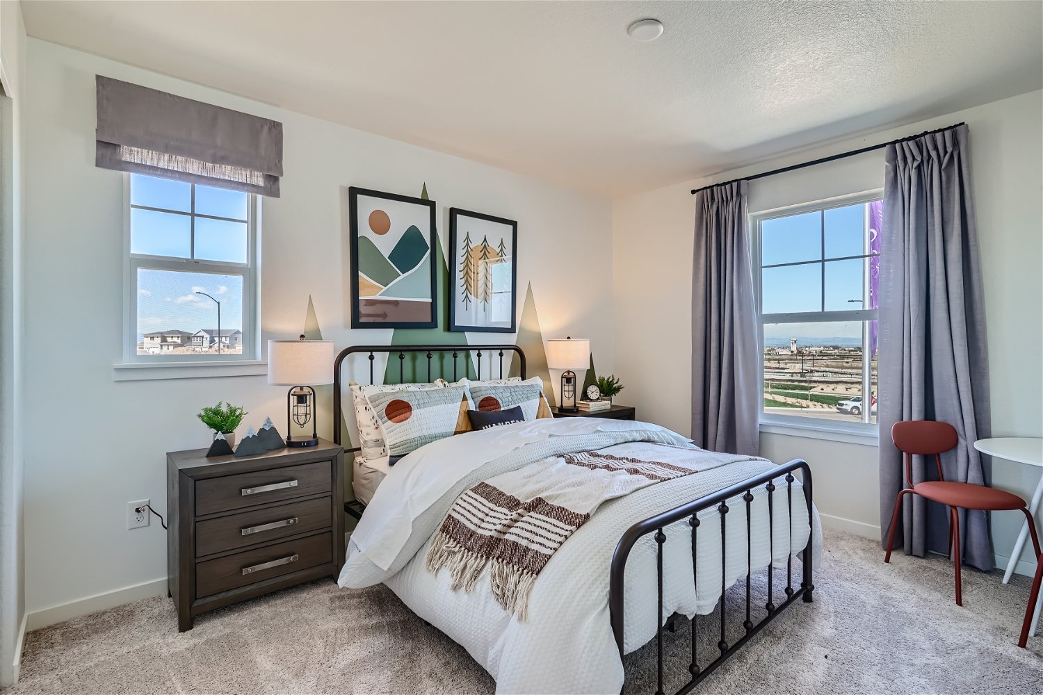 A bedroom with a bed and a window.