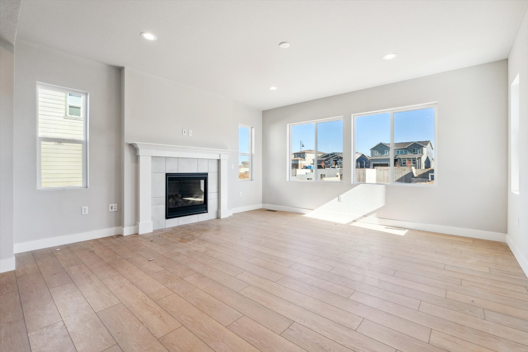 A large room with a fireplace.