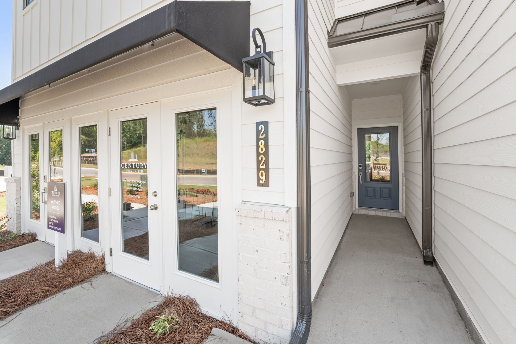 A white building with glass doors.