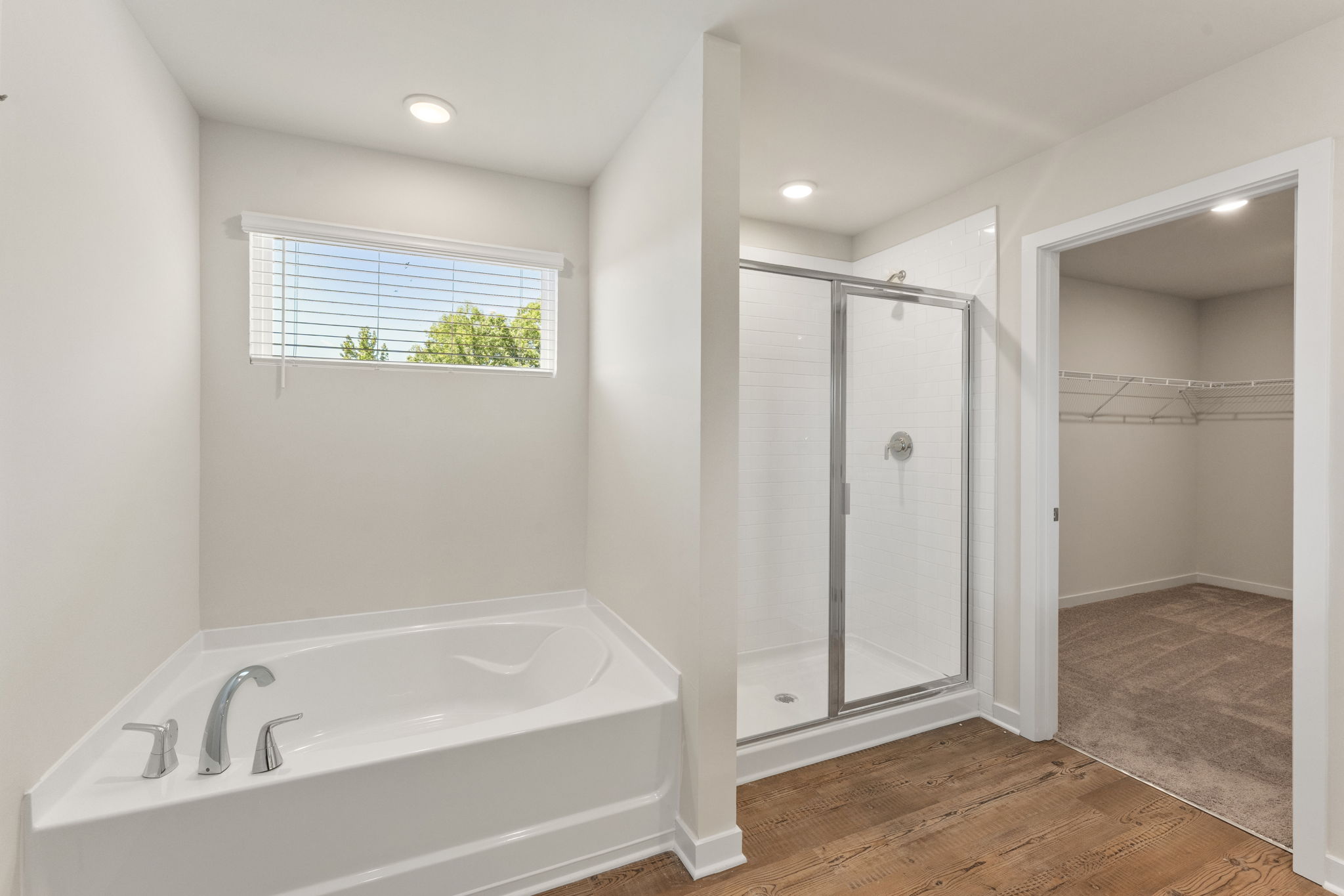 A bathroom with a tub and shower.