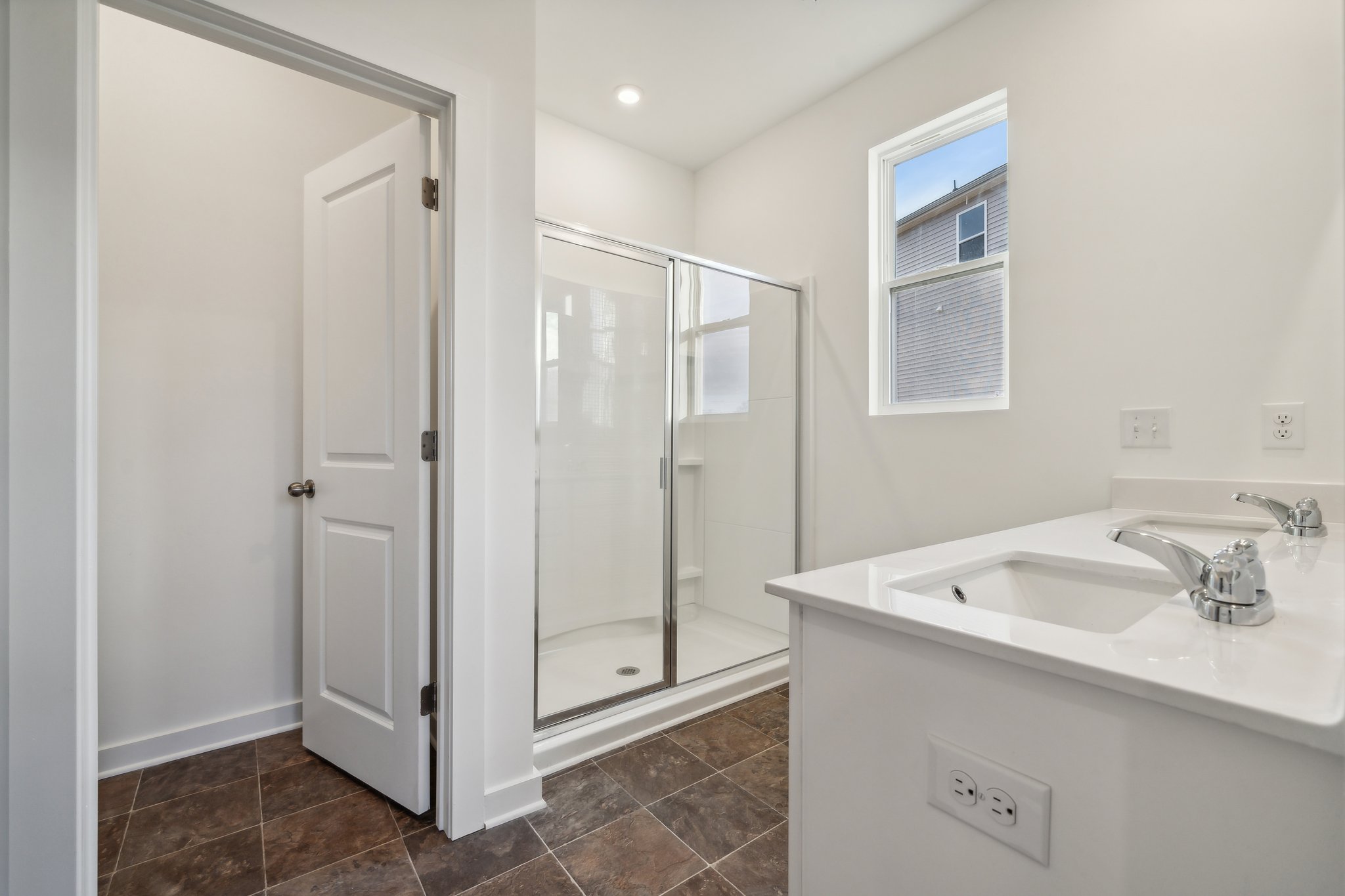 A bathroom with a glass shower.