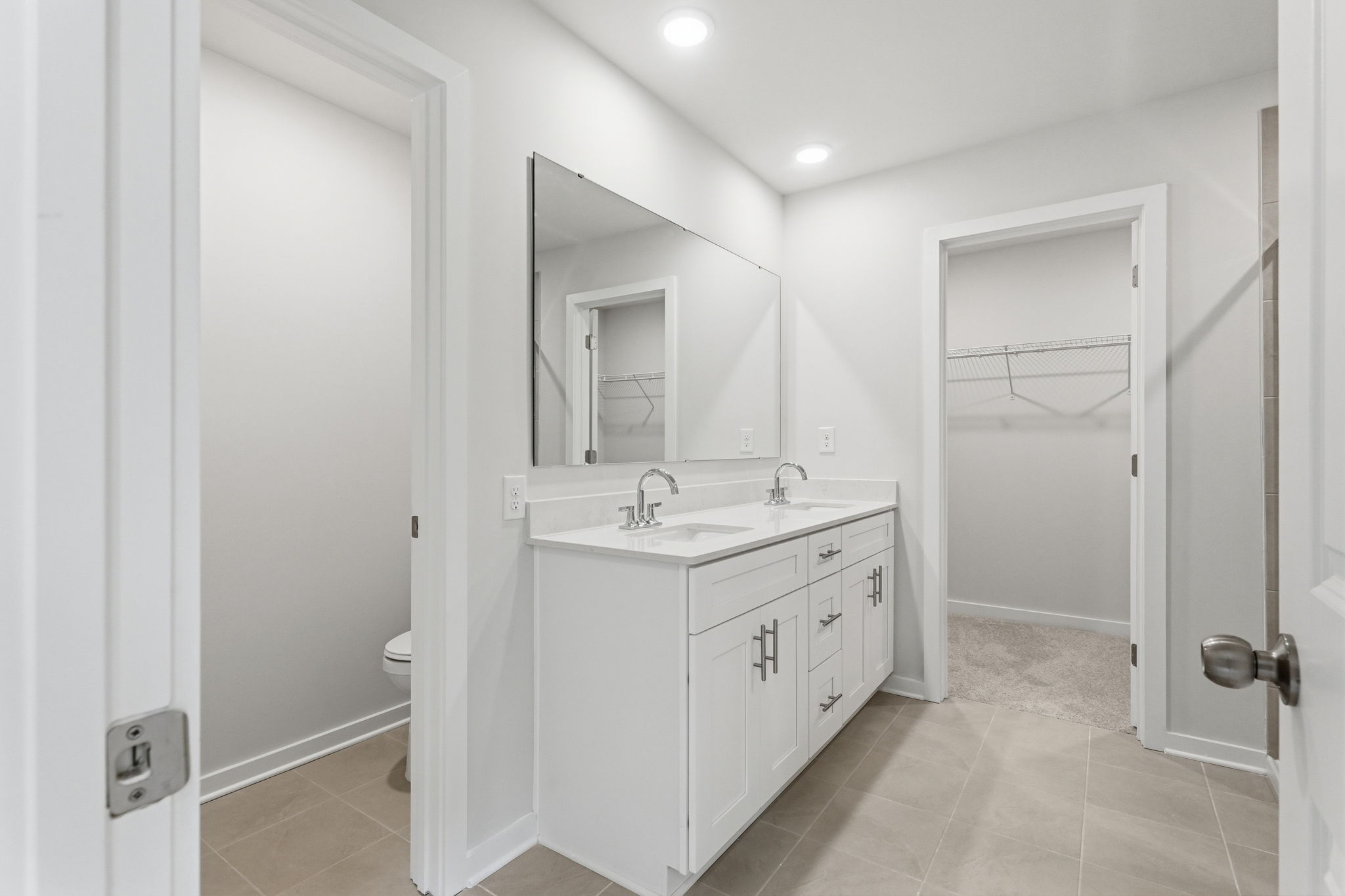 A bathroom with a sink and a shower.
