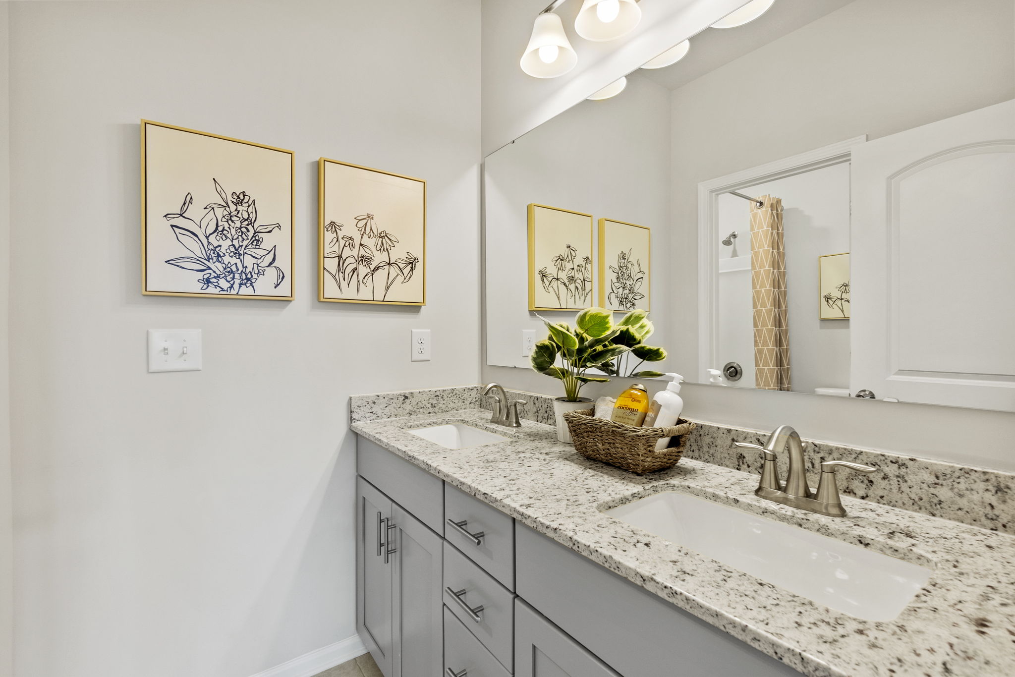 A bathroom with a large mirror.