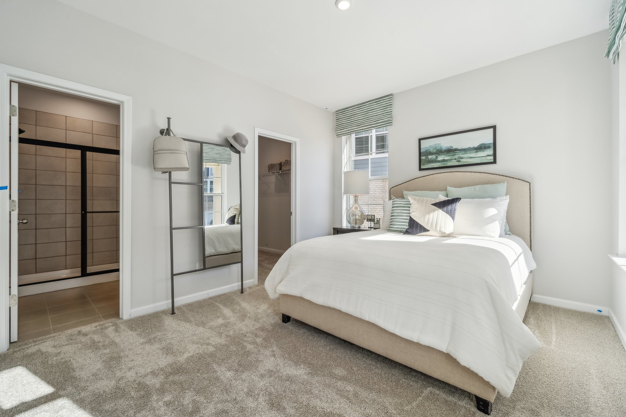 A bedroom with a large bed.