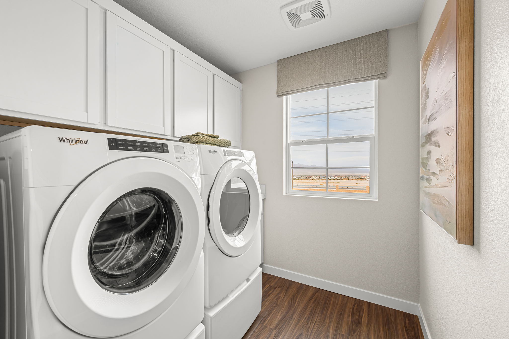 A washing machine in a room.