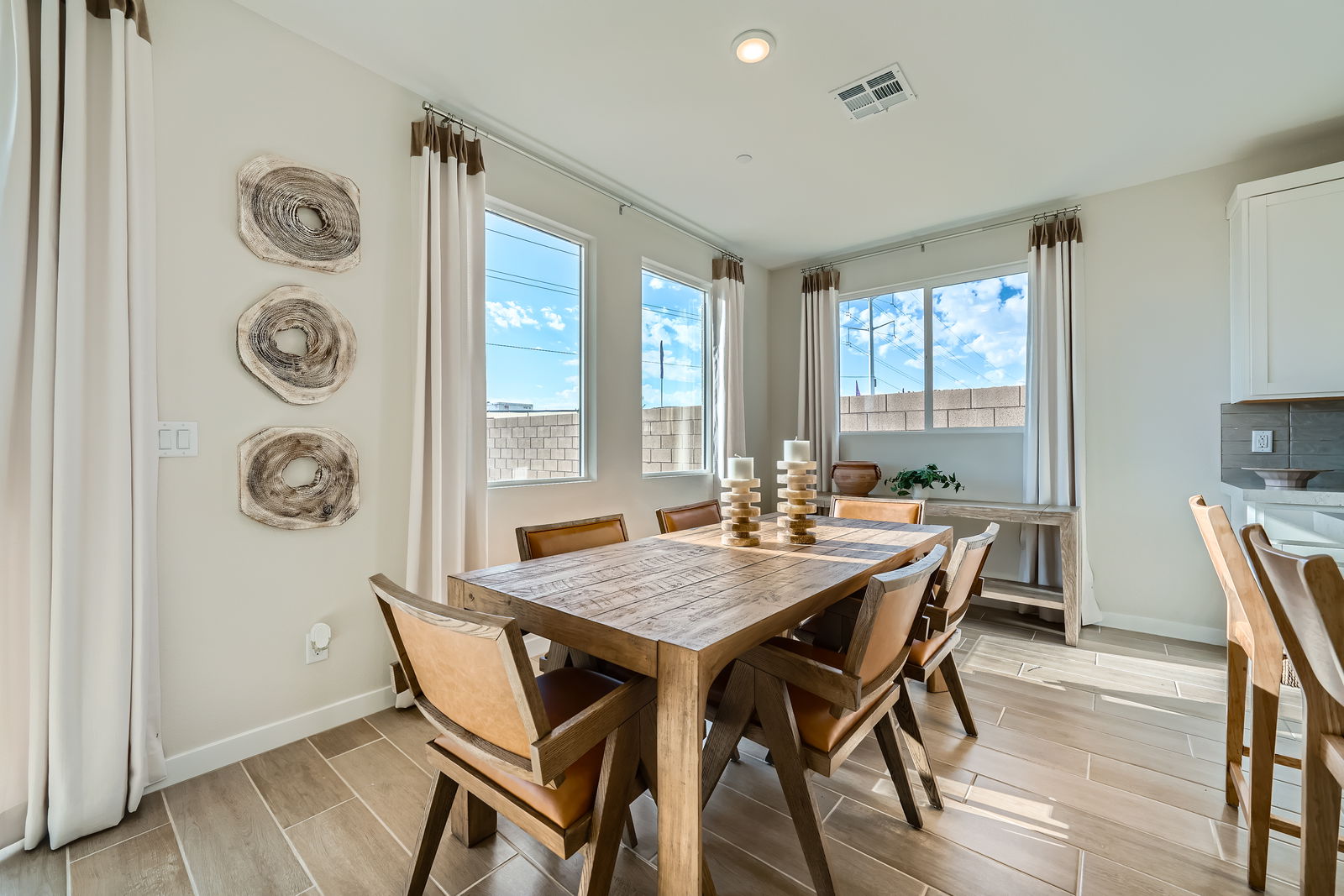 A dining room with a large window.