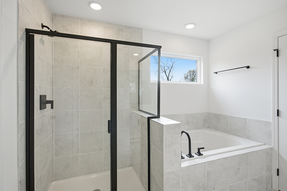 A bathroom with a glass shower.