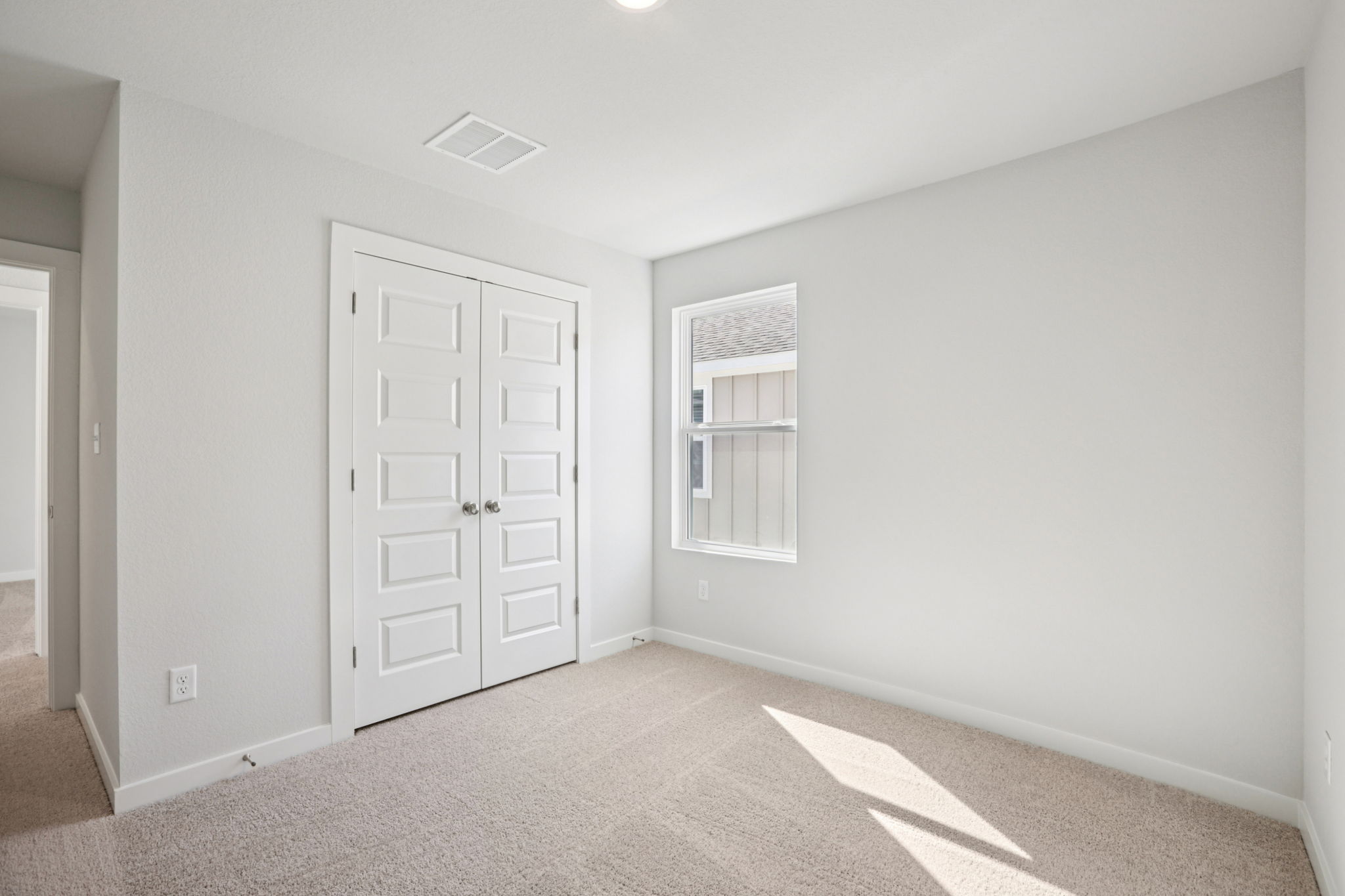 A room with white doors.