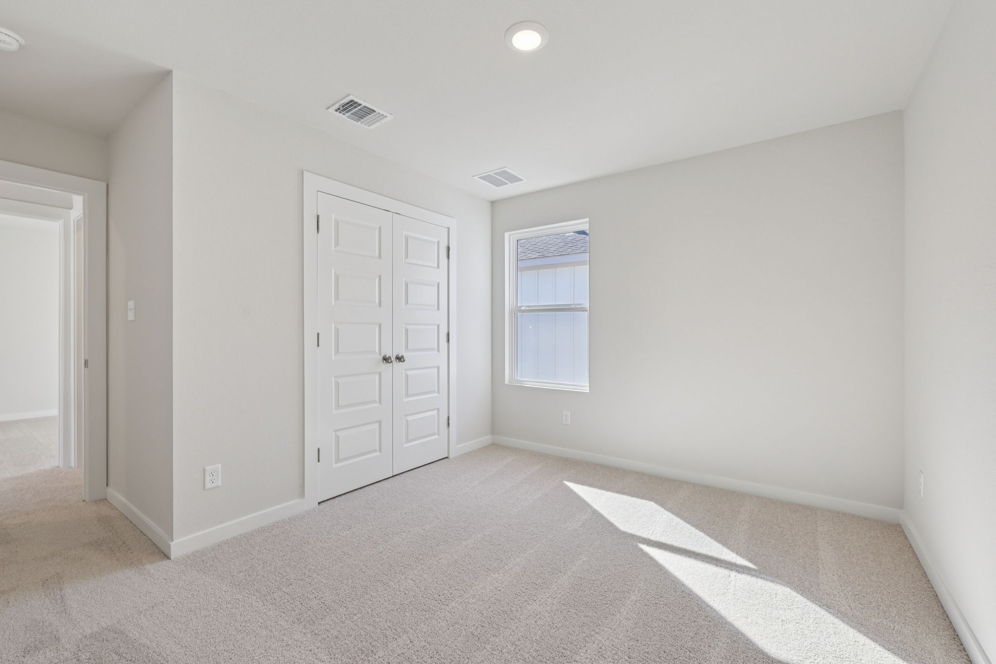 A room with white doors.