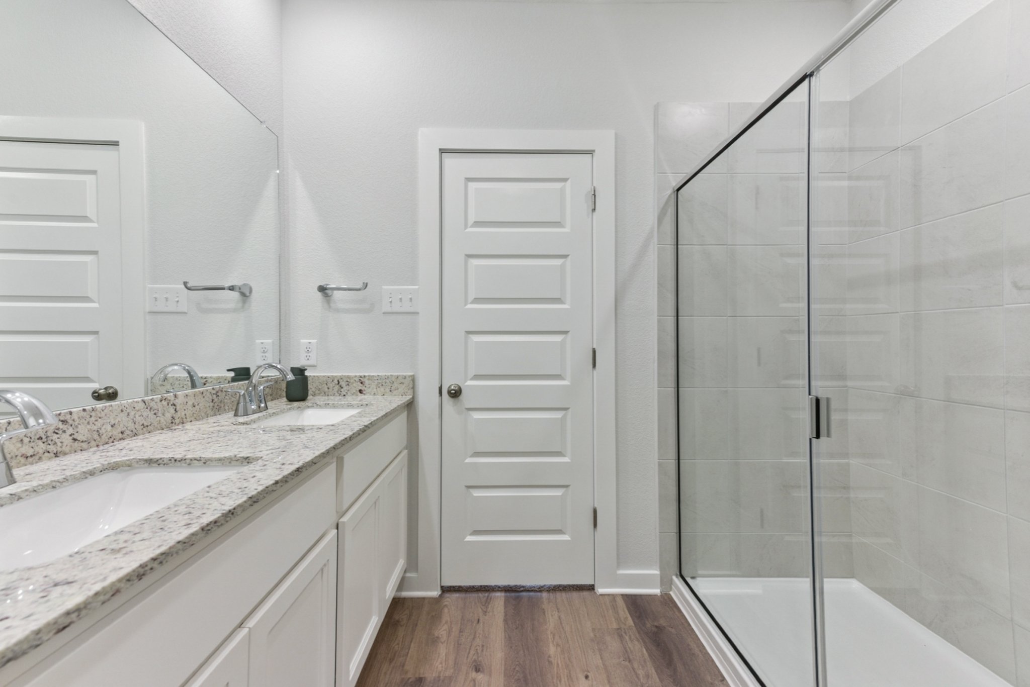 A bathroom with a glass shower.