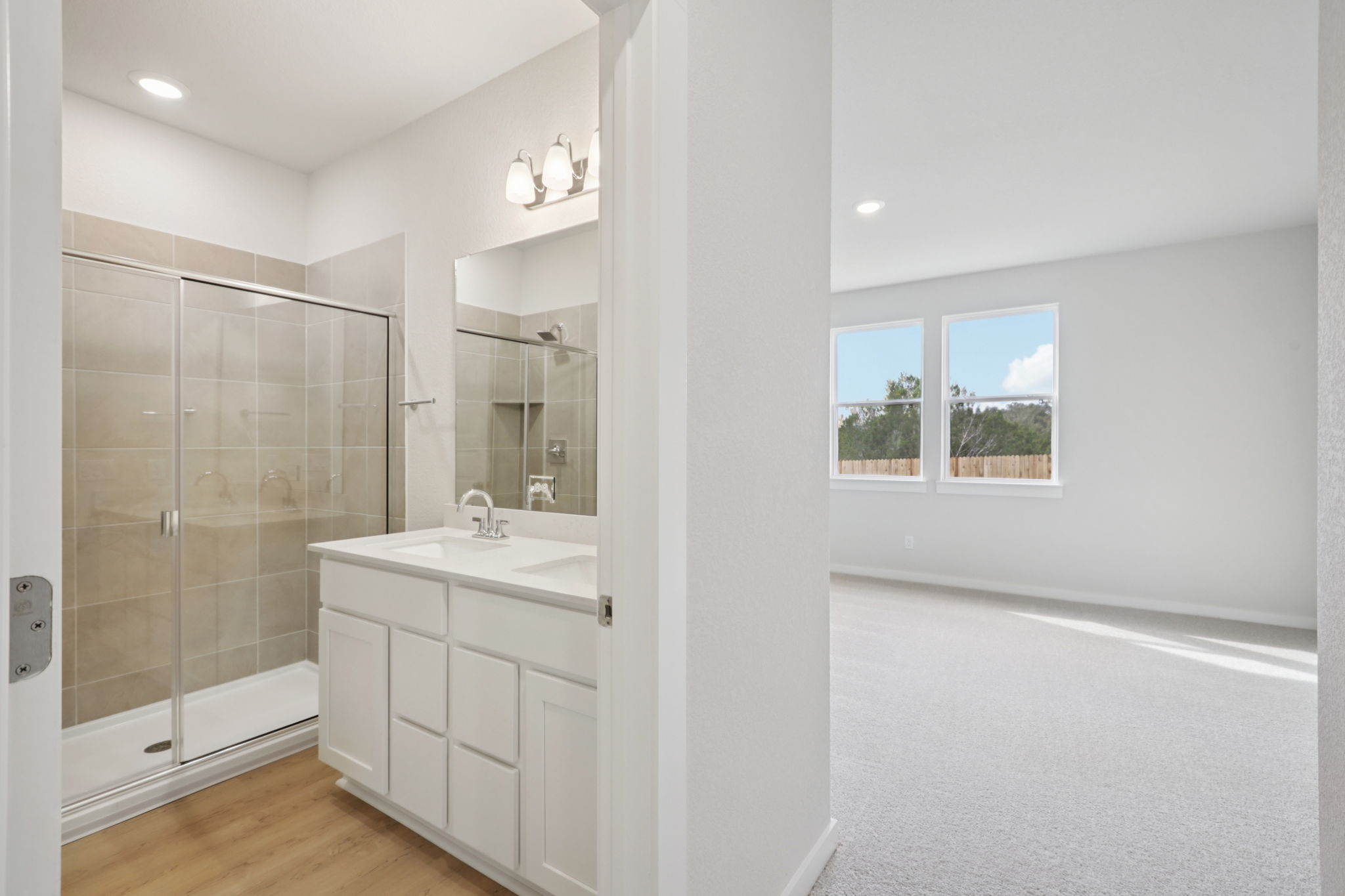 A bathroom with a glass shower.