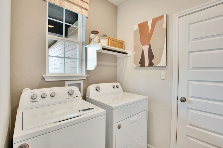 A laundry room with a washer and dryer.