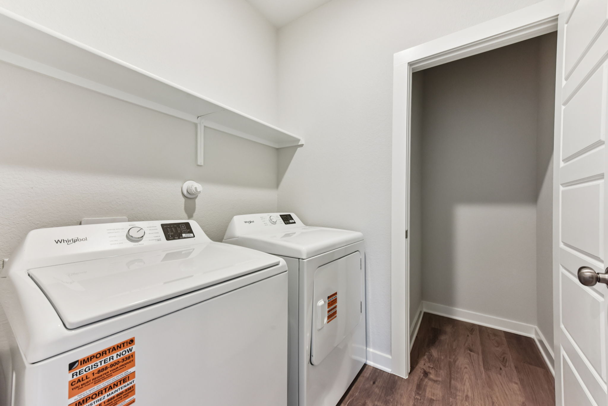 A white washing machine in a room.