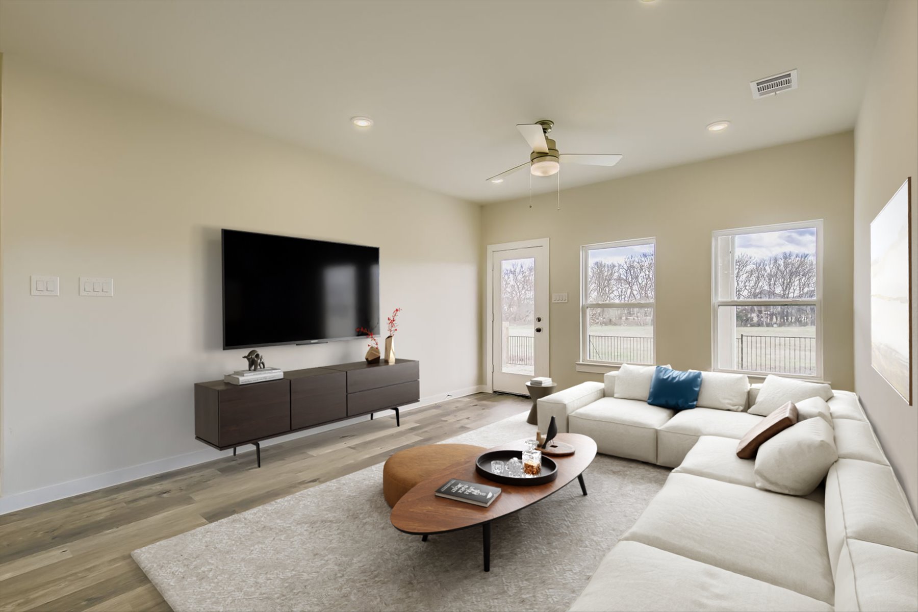 A living room with a tv and couches.