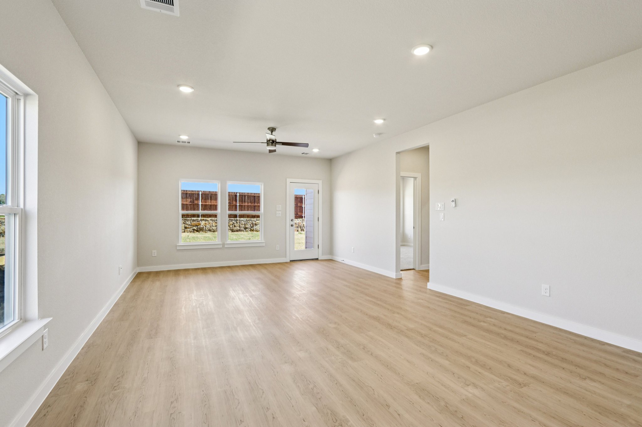 A room with a wood floor and a wood floor.