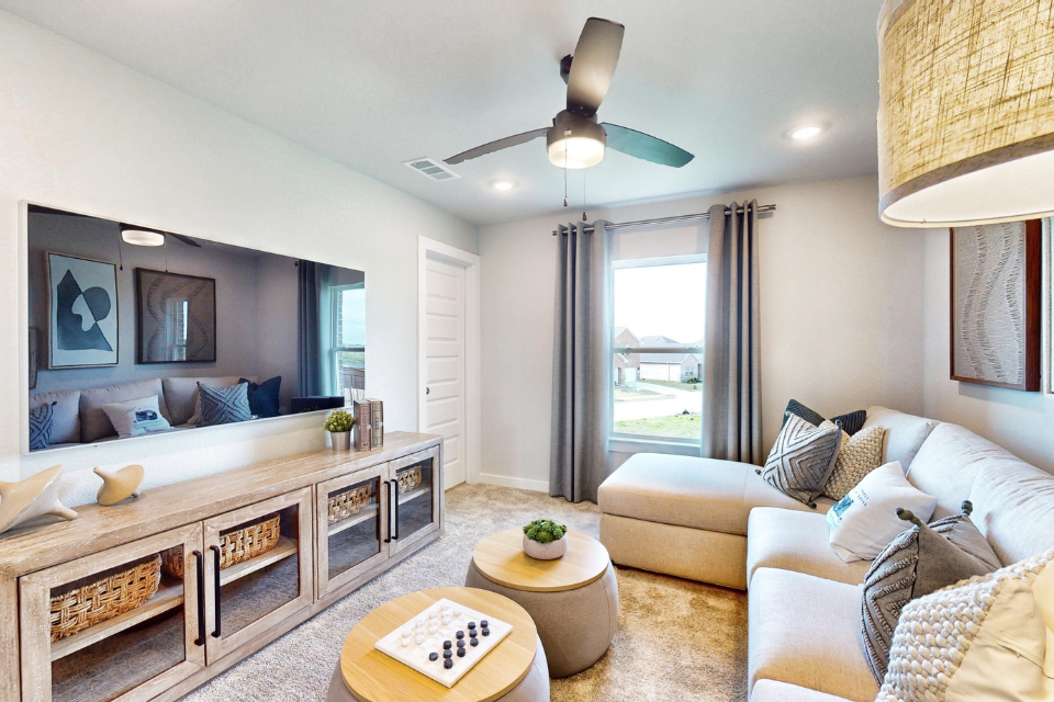 A living room with a large window.