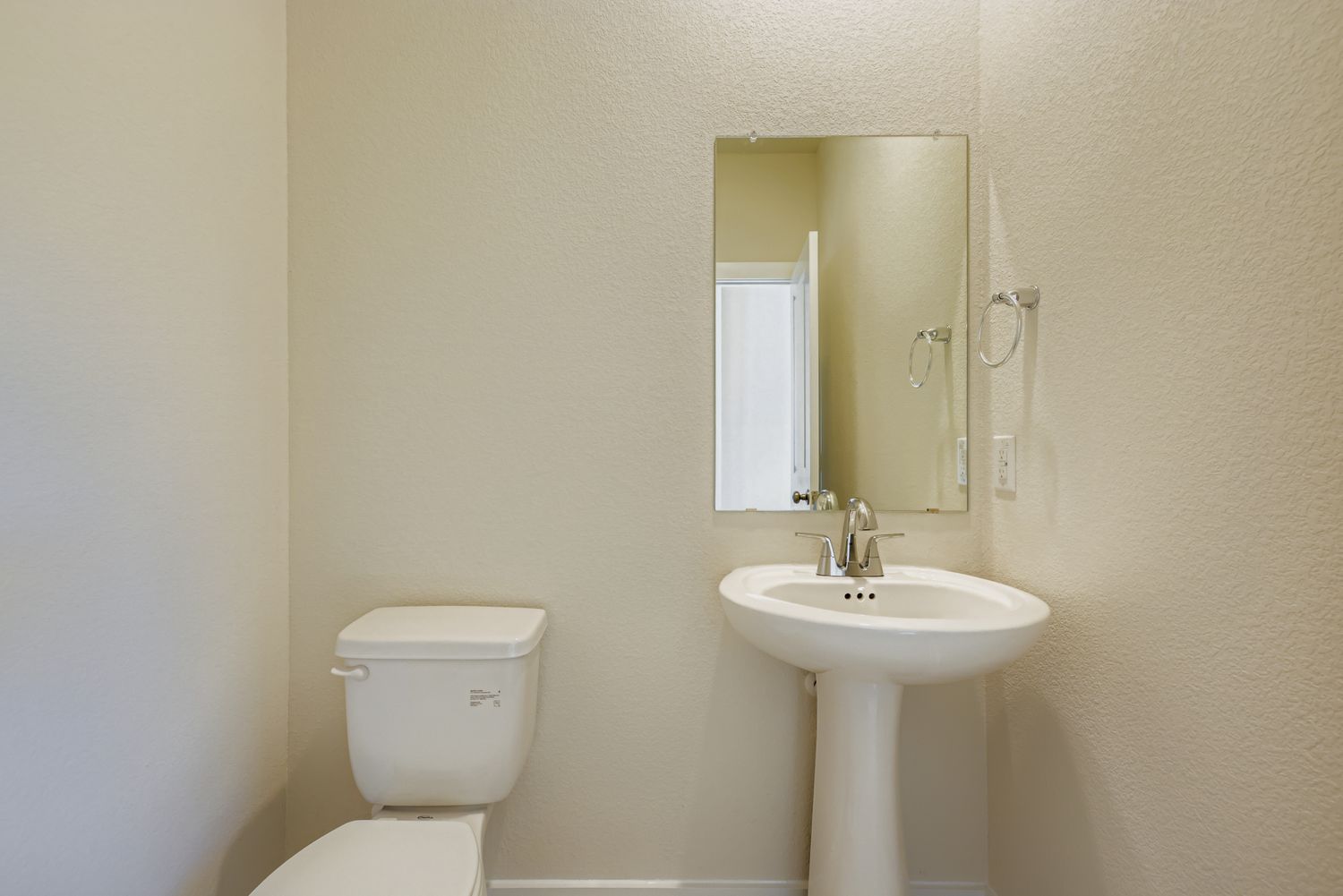 A bathroom with a sink and toilet.
