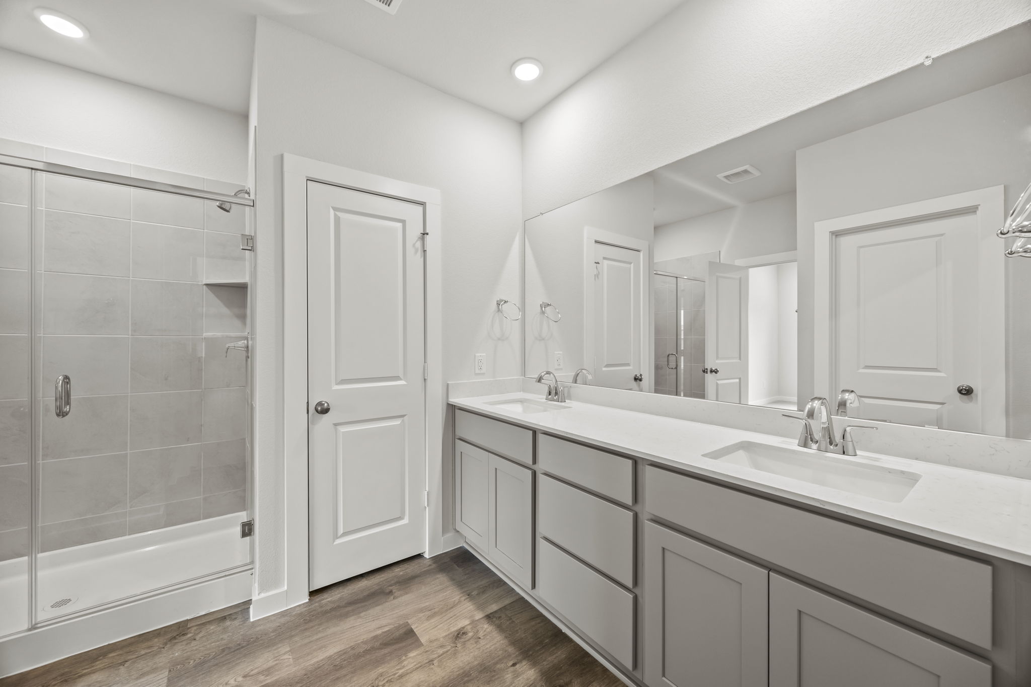 A bathroom with a glass shower.