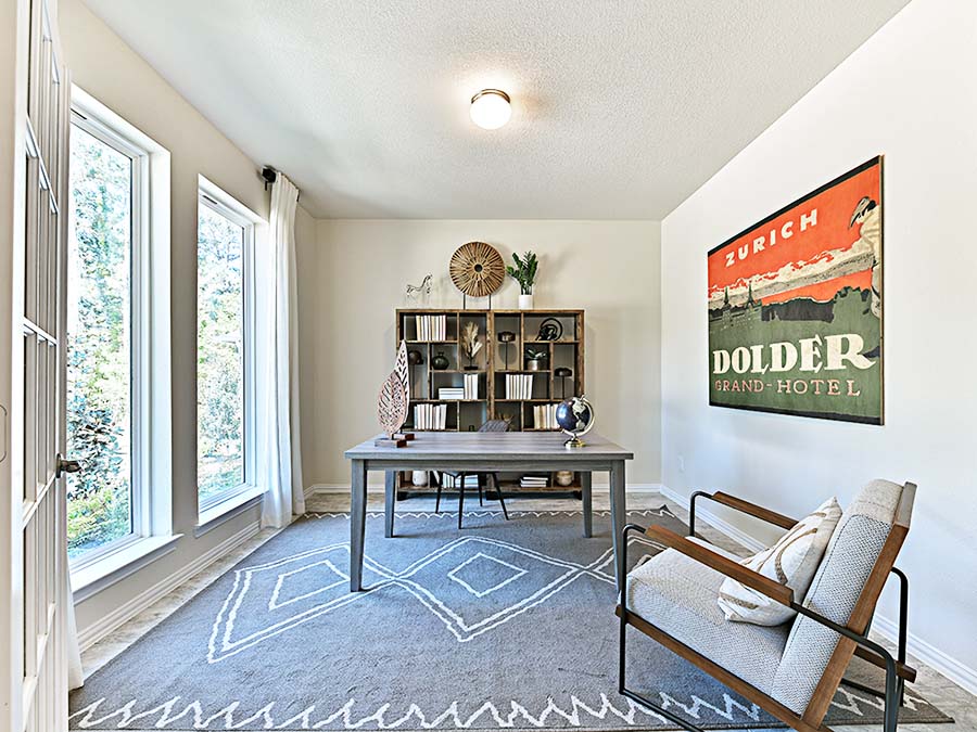 A room with a table and chairs.