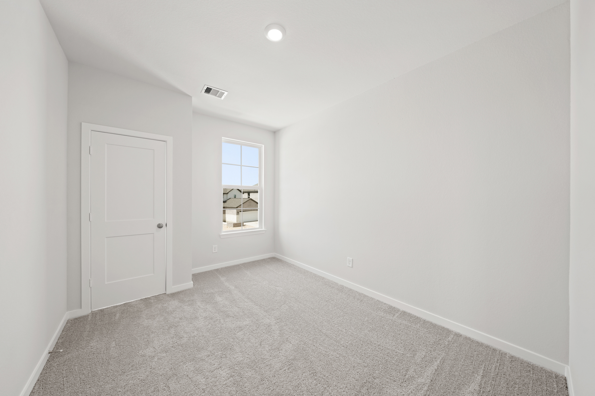 A room with a door and a window.