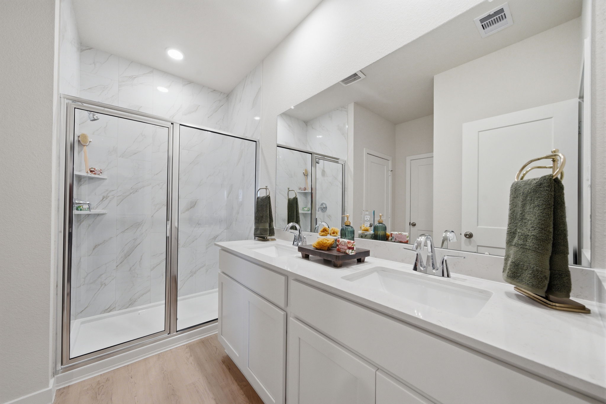 A bathroom with a glass shower.