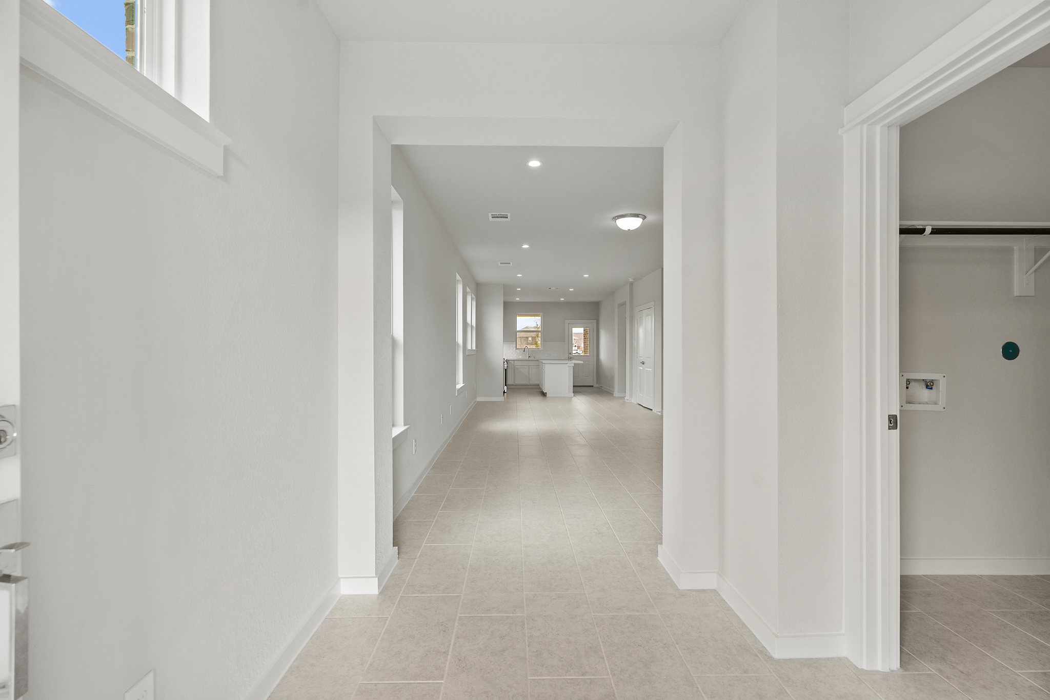 A long hallway with white walls.