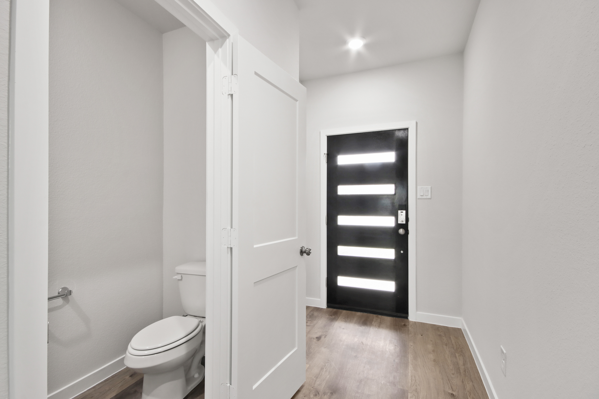 A bathroom with white walls.