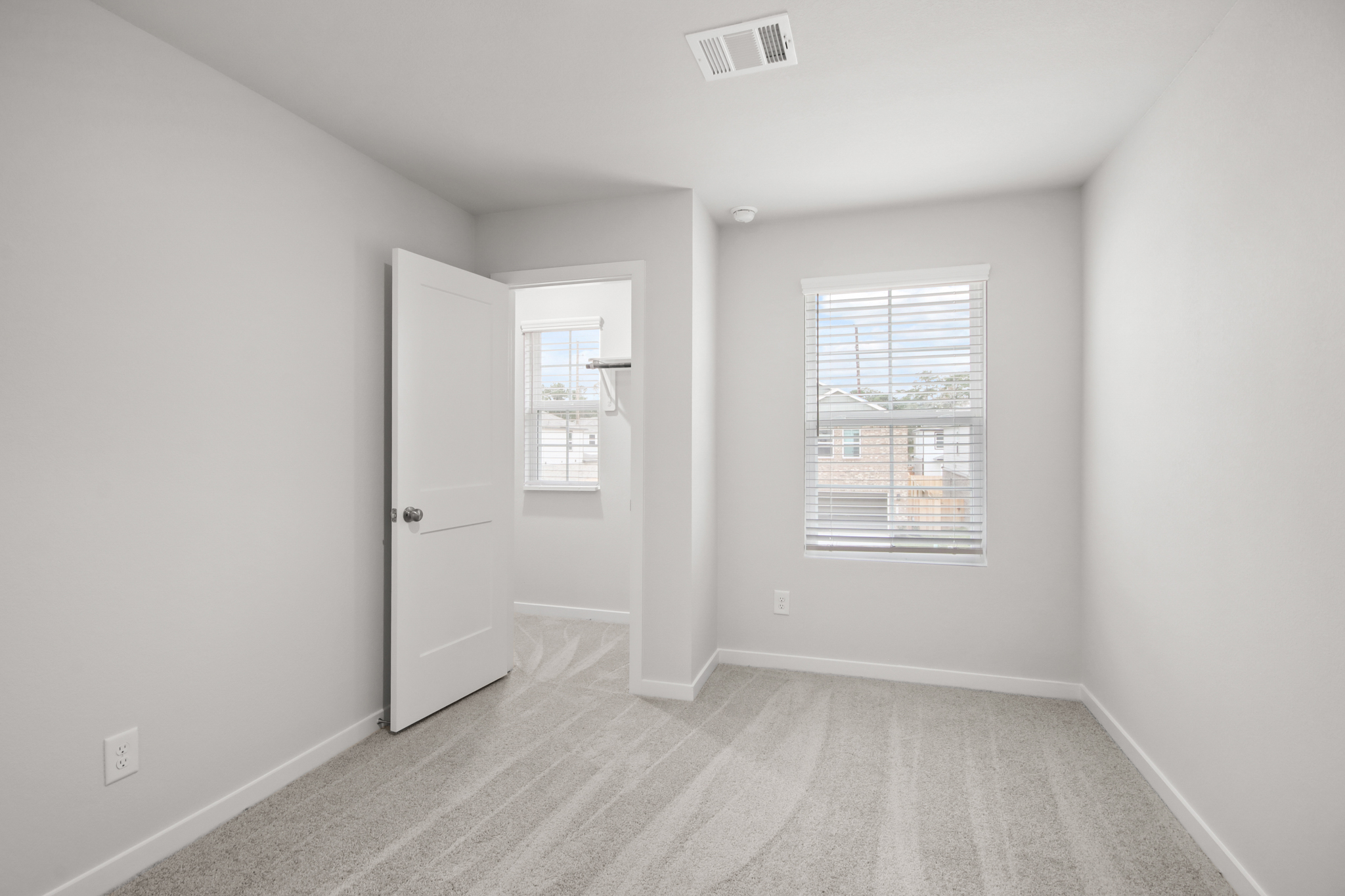 A room with a door and a window.