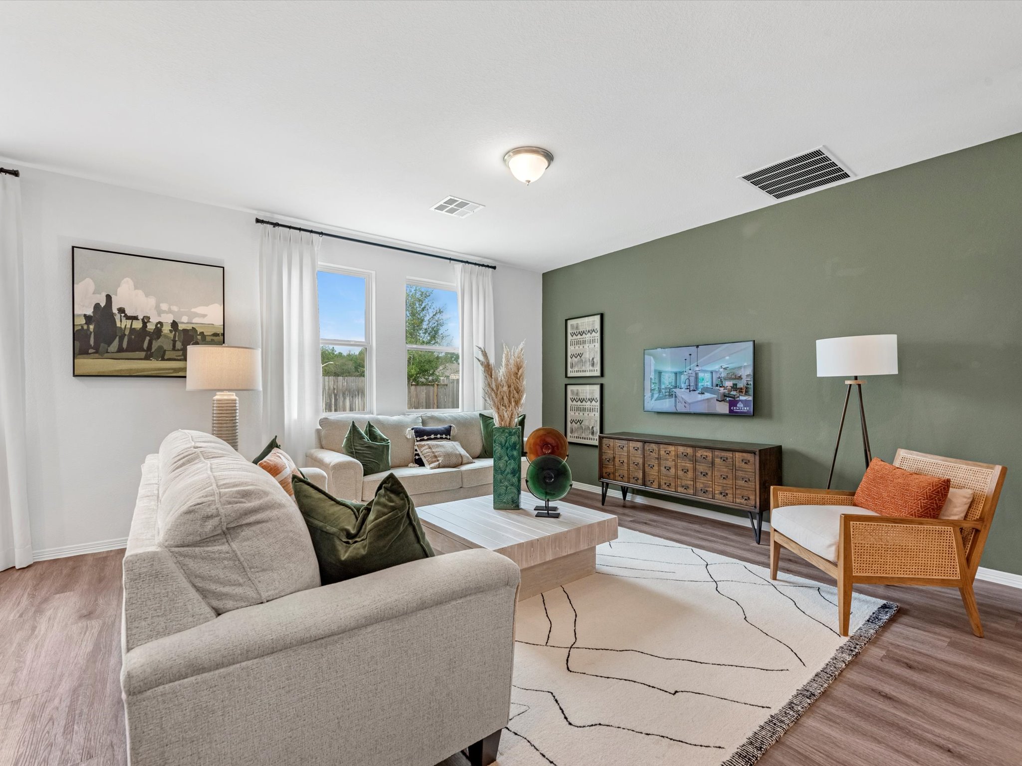 A living room with a large tv.