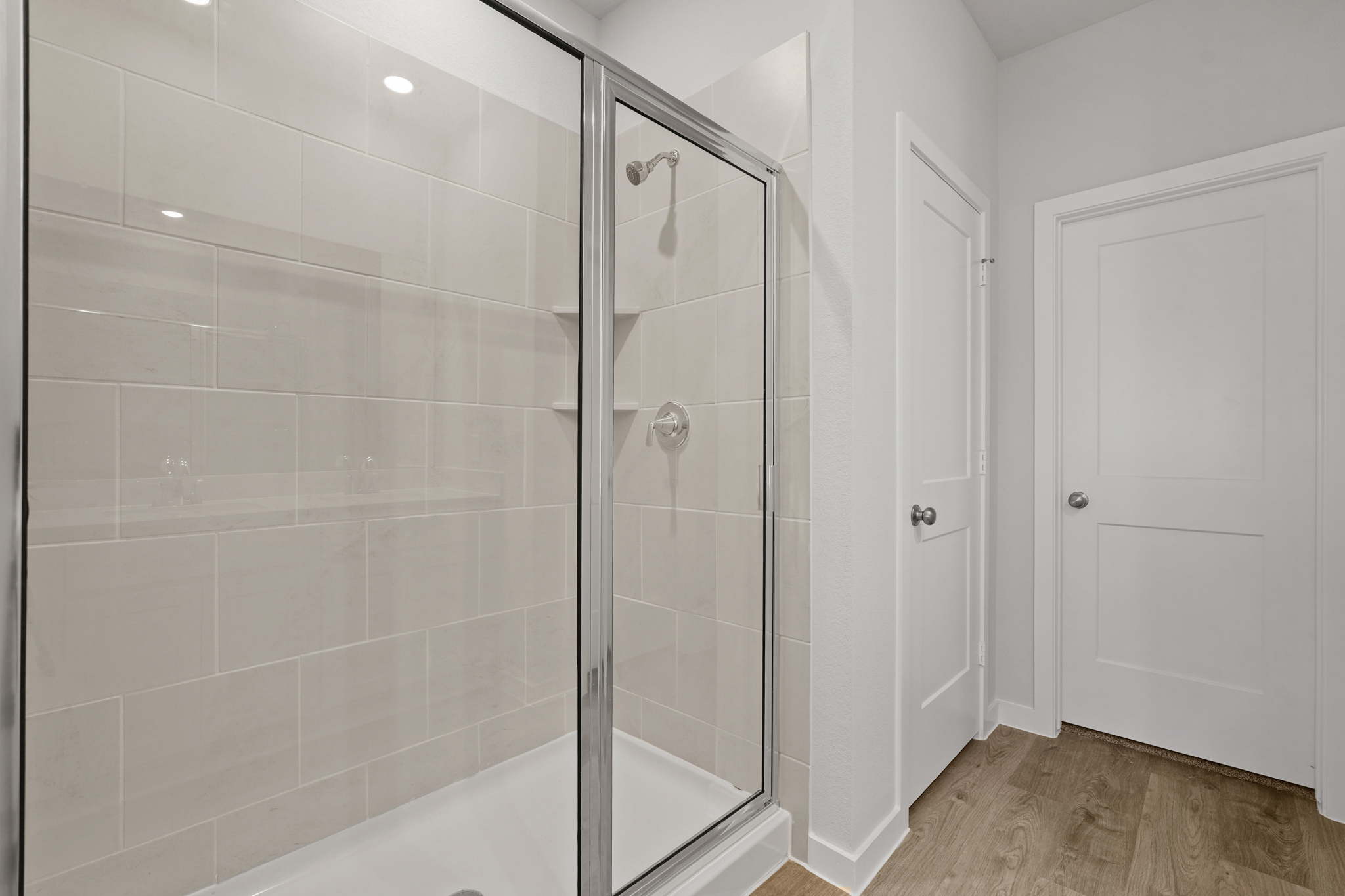 A bathroom with a glass shower.