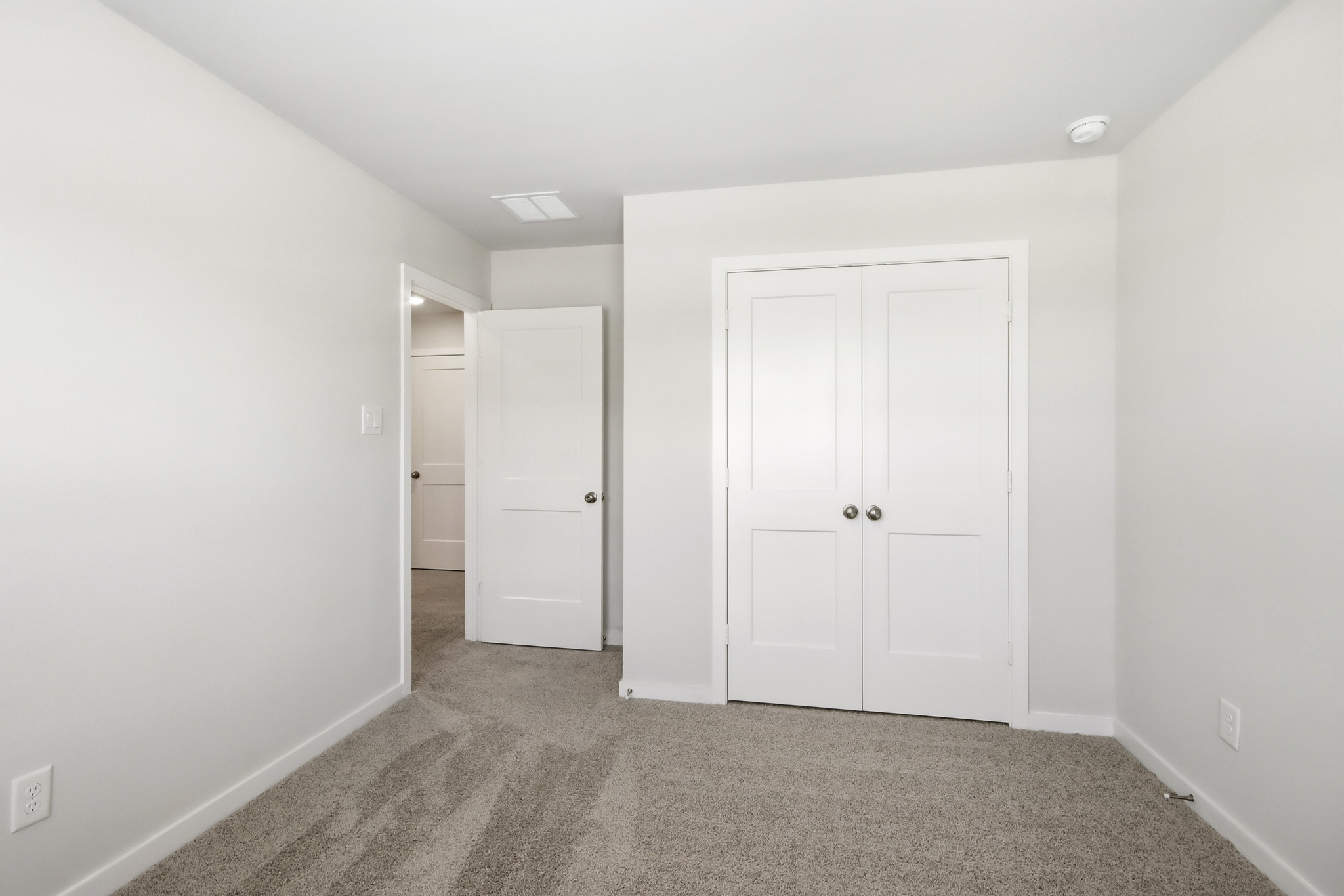 A room with white doors.