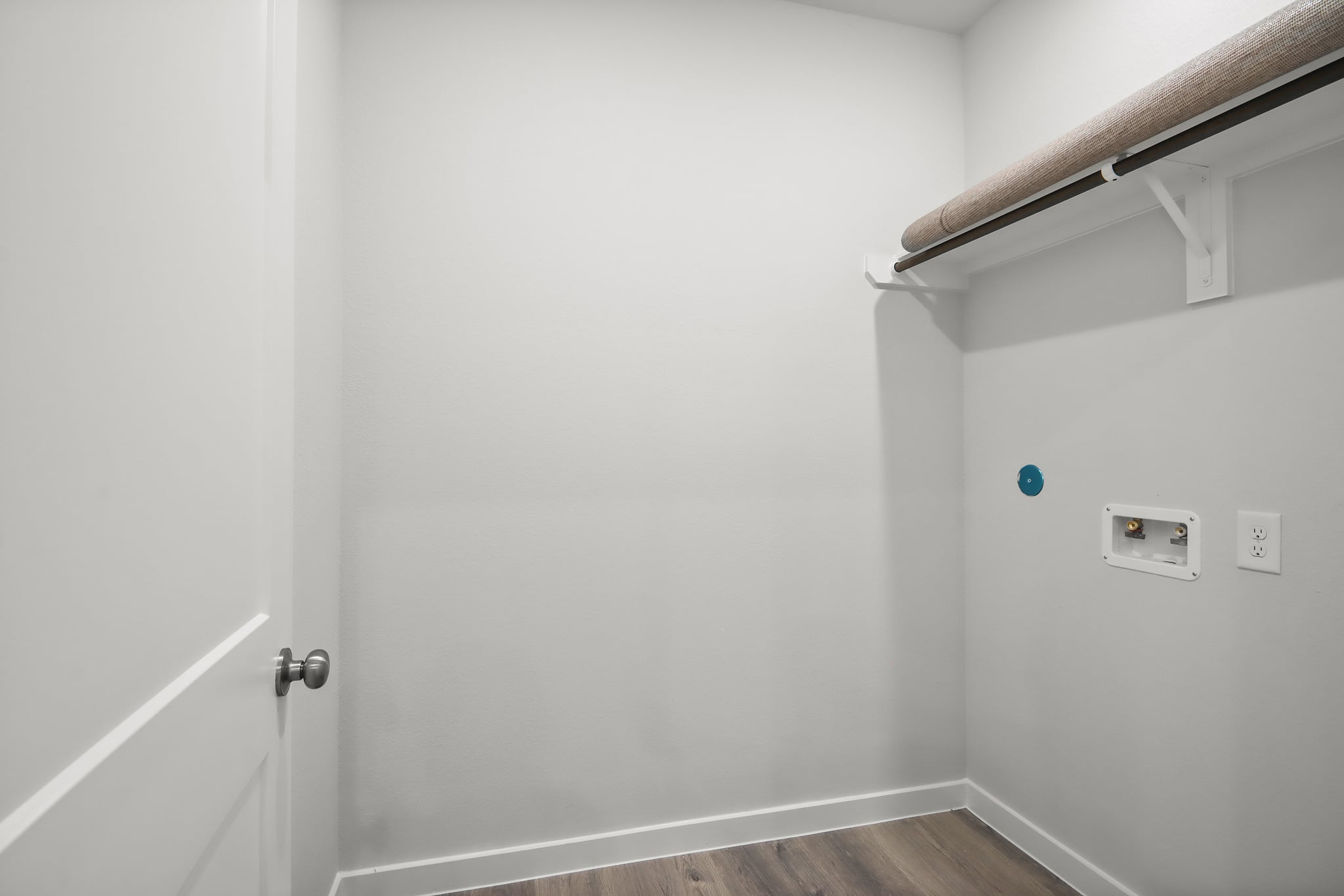 A white door with a light above it.