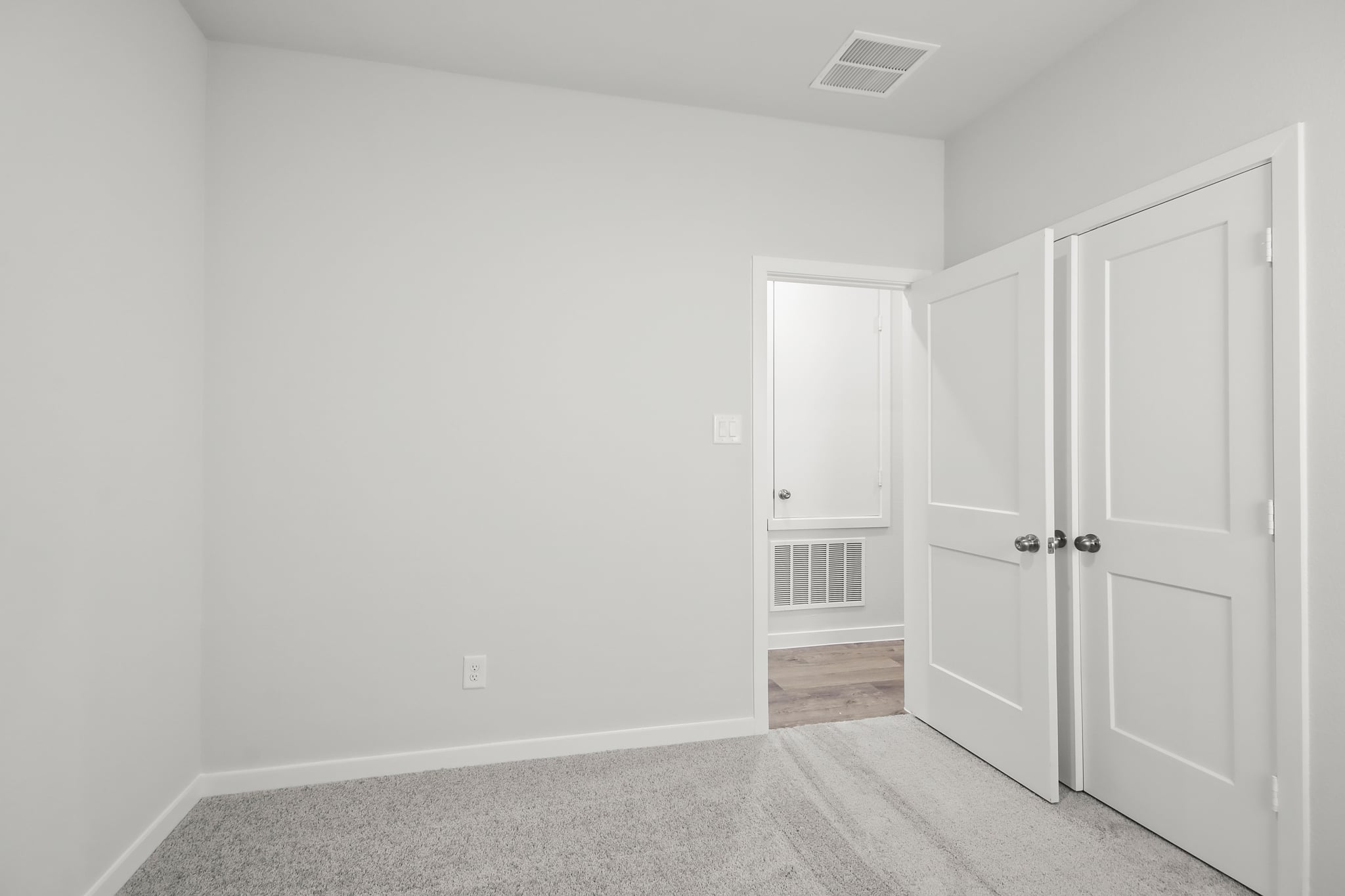 A room with white doors.