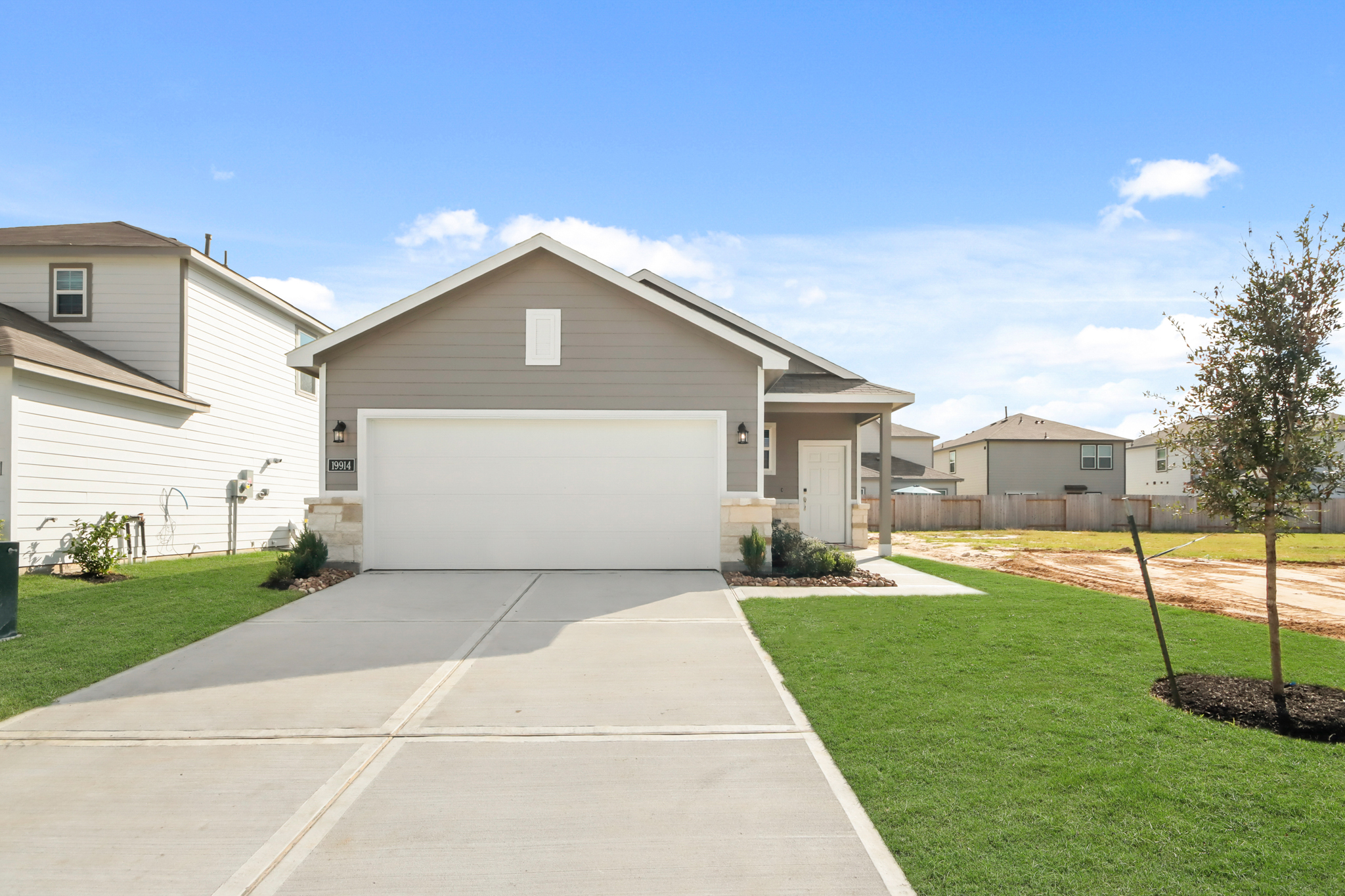 A driveway leading to a house.