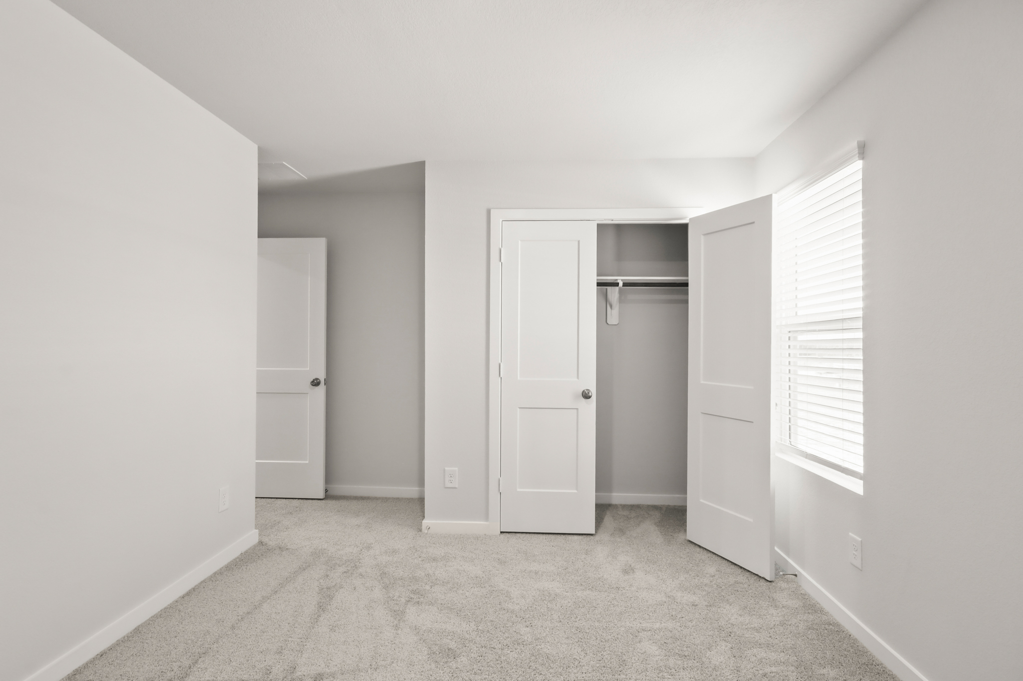 A room with white doors.