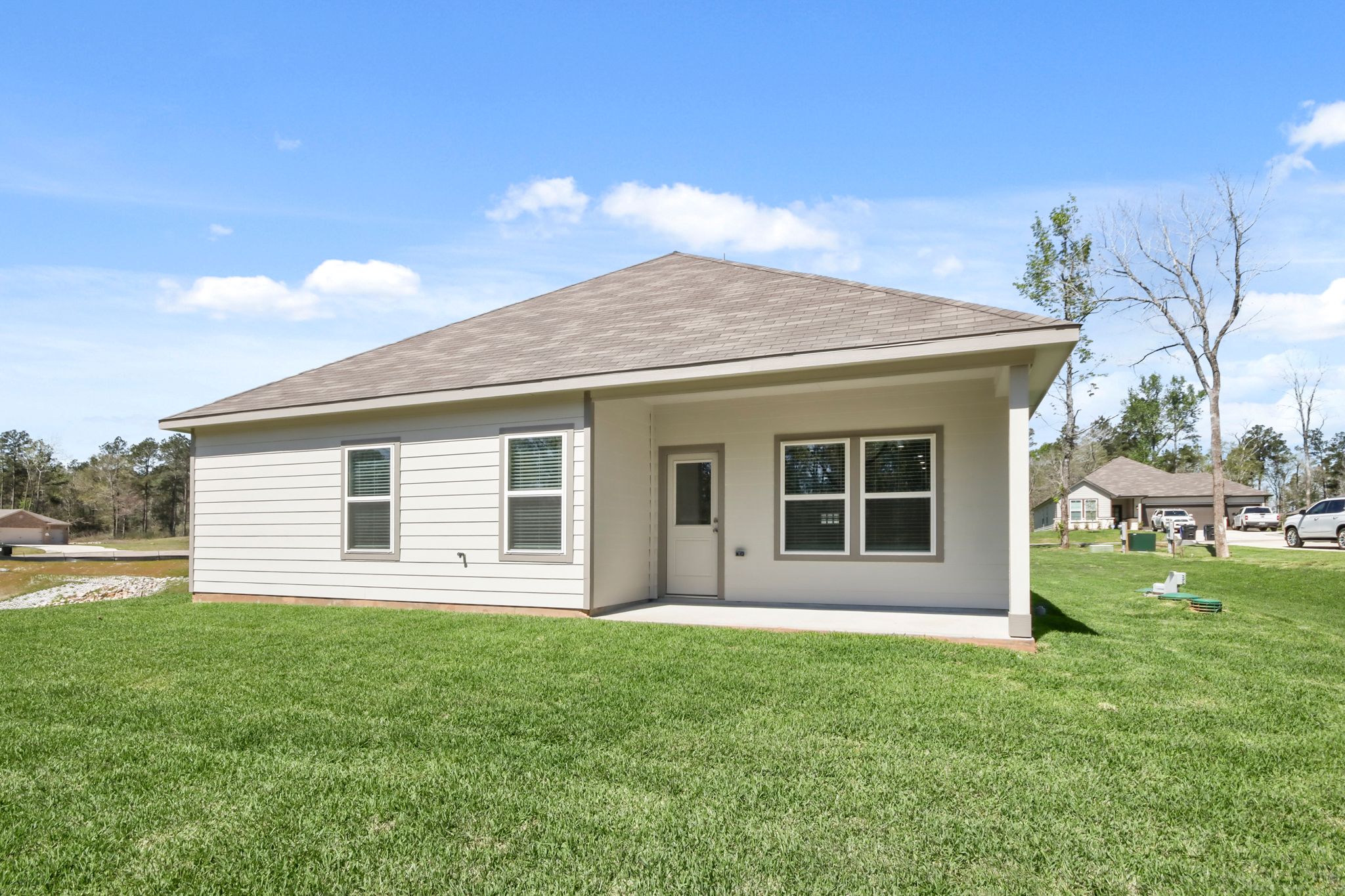 A house with a grass yard.