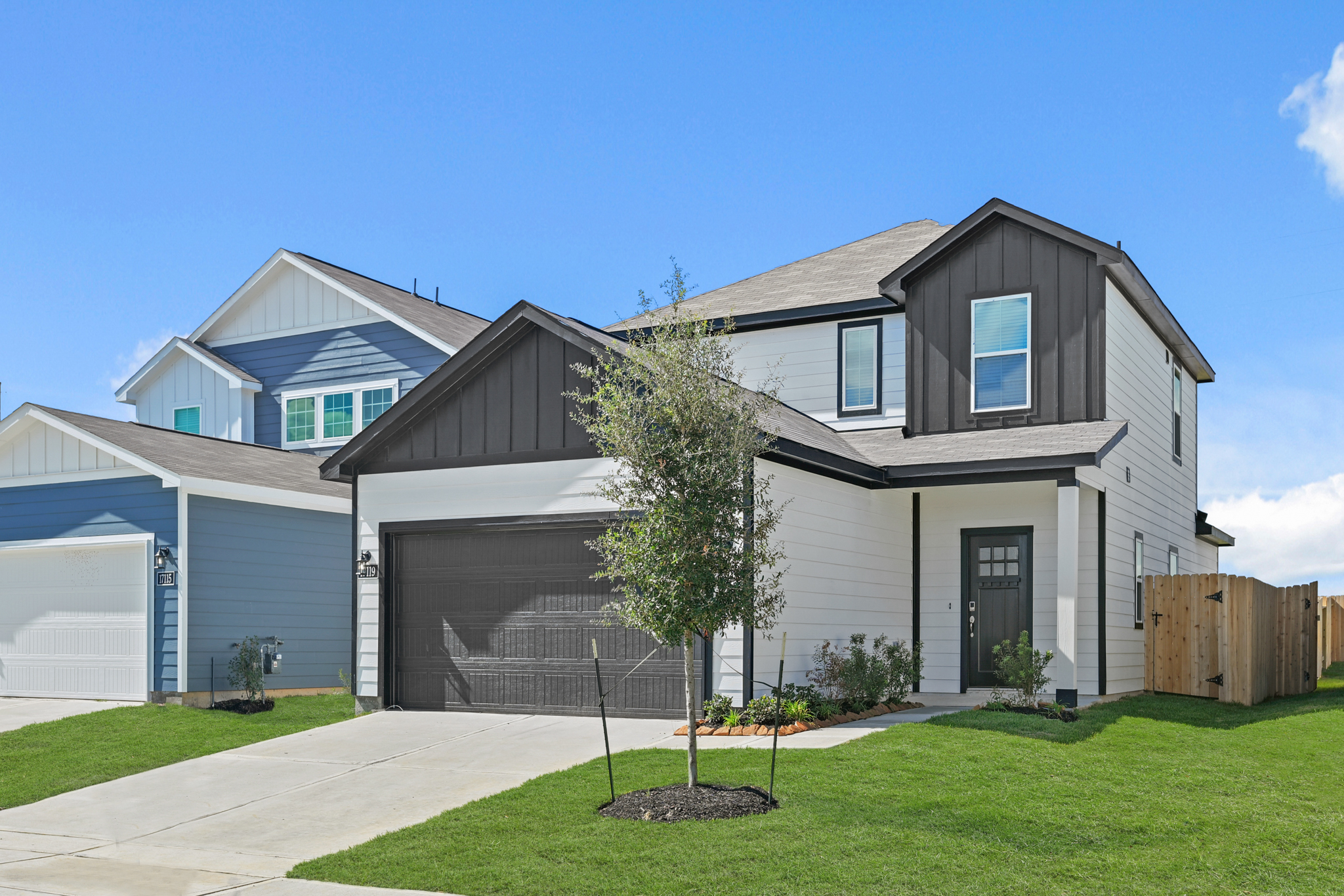 A house with a tree in the front.